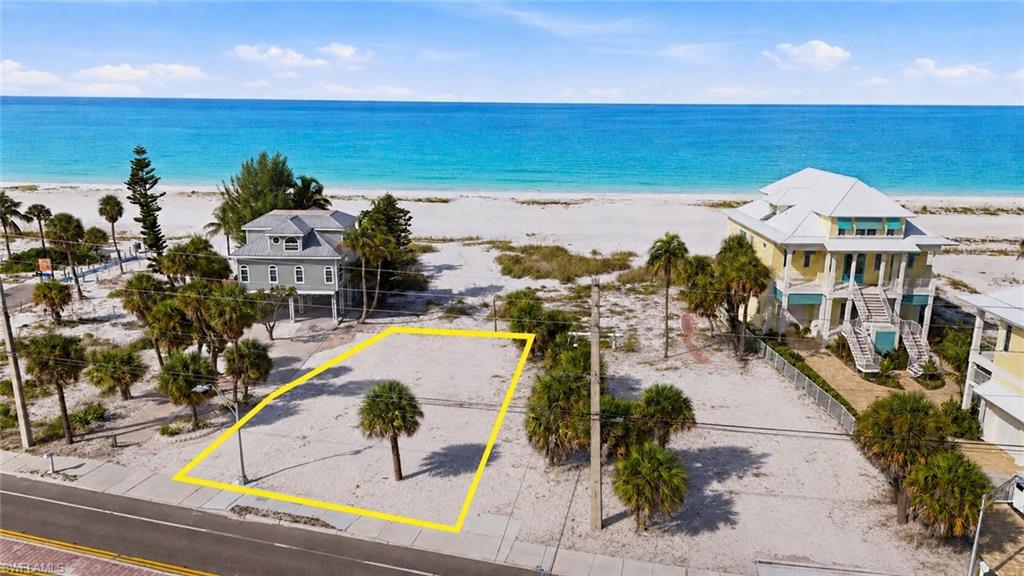One or more photo(s) has been virtually staged, AI generated or rendered.  SUNSETS OVER THE GULF. SAND BETWEEN YOUR TOES. YOUR OWN BEACH HOMESITE IN THE HEART OF FORT MYERS BEACH. This is the kind of location people come to Florida searching for—a homesite just steps from the beach where Gulf breezes, warm tropical evenings and unforgettable Southwest Florida sunsets can become part of everyday life. 
Welcome to 5680 Estero Blvd, an exceptional opportunity to build your vision on Fort Myers Beach. Comes with a Direct beach easement to flip flop right to the sand. As well as a nearby beach access if you want to drive your golf cart or walk in that area.  The potential for partial Gulf views—an incredible setting for a custom coastal retreat. Huge Rental Income Potential, this is a STR Dream location. 

Picture mornings walking the shoreline, afternoons spent on the Gulf and evenings watching the sky come alive as the sun disappears beyond the water. Whether your vision is a luxurious island residence, a seasonal escape or an investment property, this location delivers the lifestyle that makes Fort Myers Beach so special.
 Enjoy convenient access to the island’s restaurants, entertainment and recreation, with Bonita Springs, Estero and Naples also within easy reach. You can build a beautiful home almost anywhere—but you can’t recreate a location like this. Own your piece of Fort Myers Beach and build the lifestyle you’ve been dreaming about.
The House in the Picture is Not included in the Sale of the Lot. This is a Lot sale only. Builder referral available.