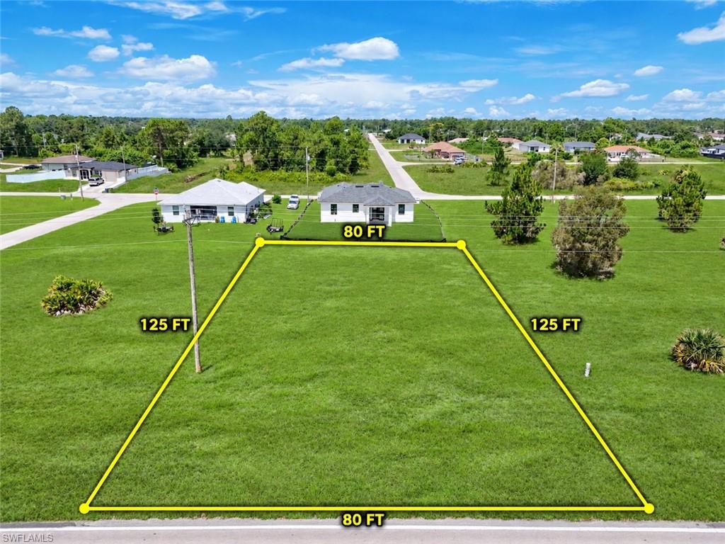 Discover the opportunity to build your Florida dream home on this 0.23-acre (80' x 125') residential lot with desirable western rear exposure, perfect for enjoying Southwest Florida's beautiful sunsets. Situated on a quiet street in a semi-country setting, this homesite offers the ideal balance of privacy and convenience. With plenty of room for a custom home, pool, outdoor living area, or additional structures, the possibilities are endless.

Located in a growing area of Lehigh Acres with newer homes nearby, you'll enjoy easy access to schools, shopping, restaurants, and major roadways. Just a short drive to Fort Myers, Naples, RSW International Airport, and the beautiful Gulf Coast beaches.

An added bonus—this seller is also offering the adjoining lots on both sides of this parcel. Purchase one, two, or all three lots to create your own private estate, investment opportunity, or the ultimate Florida lifestyle.