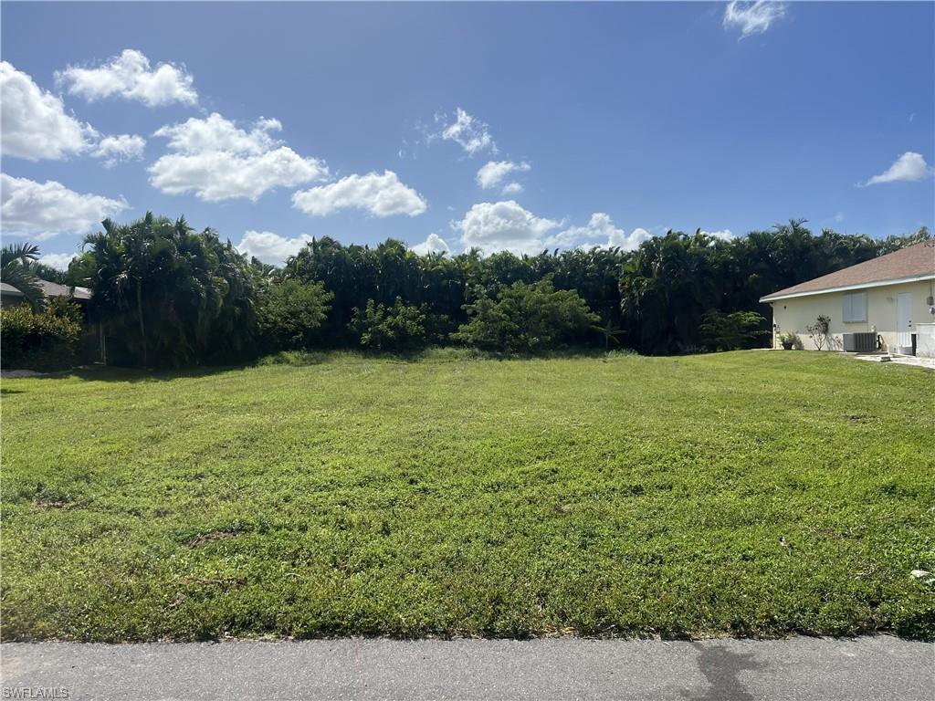 Build your dream home on this cleared 0.23-acre lot in one of Southwest Cape Coral’s most desirable spots. All water and sewer assessments are paid, and no critters!  This lot sits on a quiet street just a short stroll from Cape Harbour Marina, where you’ll find waterfront restaurants, shops, live music, and easy boat access.  
This area continues to attract buyers who want the Florida lifestyle without the long commute to the water, with the Cape Coral Yacht Club Public Beach being just a few miles away.  A short drive puts you at SunSplash Waterpark, Four Mile Cove Ecological Preserve, or even Fort Myers Beach or Sanibel Island.
Cape Coral keeps growing with new mixed-use projects, road improvements, and expanded services, yet this corner of the city still feels like an old Florida neighborhood. 
Whether you’re planning a full-time home, a seasonal getaway, or a long-term investment, this lot gives you a clean slate in a location people actually want to live in.
NO HOA!!