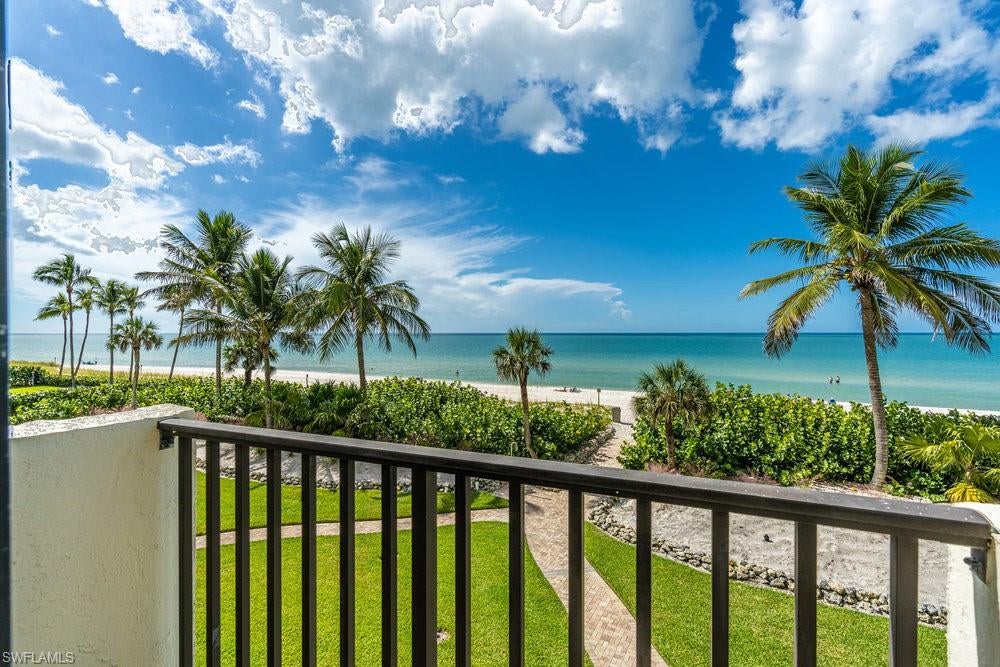 This Naples condo, “Bayshores of Vanderbilt Beach” sits directly on the Gulf, on Vanderbilt Beach—You cannot get closer to the Gulf! Bask on the beach, by the pool or on the lanai...or under an umbrella, with your condo 10 steps away. This is a 30-unit, quiet environment with a private beach, heated pool, tennis/pickleball court and stunning landscaping. This unit 122 is three flights up with 2 bedrooms and 2 bathrooms and is being delivered turn-key furnished, move-in ready condition, with a fully equipped kitchen and storage. Think of the most tranquil beach vacation you’ve ever taken and this surpasses it.
Vanderbilt Beach is a well-kept secret and a perfect place to live or vacation…Walk to lunch or dinner at Baleen at La Playa resort or for a nightcap by the outdoor fires. This unit can be enjoyed as a personal residence or as a profitable rental property—or both. The unique bi-weekly rental policy allows for 14-night minimums or up to 26 leases per year and the unit has an excellent rental history. This building is one of the very few beachfront properties which allow rentals in Naples.
This pristine 2 bedroom has an enormous living area, dining room and additional built-in office area, screaming fast WiFi, with 2 full bathrooms including a primary bathroom and dressing room with a walk-in closet. The updated kitchen has glowing stainless steel appliances, reverse osmosis (purified) water (no more hauling bottled water), granite counters, and fully equipped with a wide variety of cooking appliances and utensils. 
There is a heated outdoor pool overlooking the beach and Gulf, on-property dedicated parking spot right up front, and across the road is your tennis/pickleball court and auxiliary parking. Docks available for rent or purchase. The condo is renovated with a tropical feeling, overlooking the Gulf--you'll be thinking you've landed in Paradise. There are panoramic views of the ocean, palm trees and sunsets from every room--the primary bedroom is also on the Gulf so you can hear the waves on the beach while you sleep. The second bedroom has views of Wiggins Pass Lagoon and your tennis/pickleball court. The beach is groomed daily and always quiet because there are only 30 units in this building with 13 private homes adjacent to the property. You could nap on the lanai, after watching the dolphins and manatees in the Gulf. 
All hurricane shutters have been upgraded, the Impact glass replaced, and the building has already accomplished it’s Milestone Inspection and Structural Integrity Reserve Study.