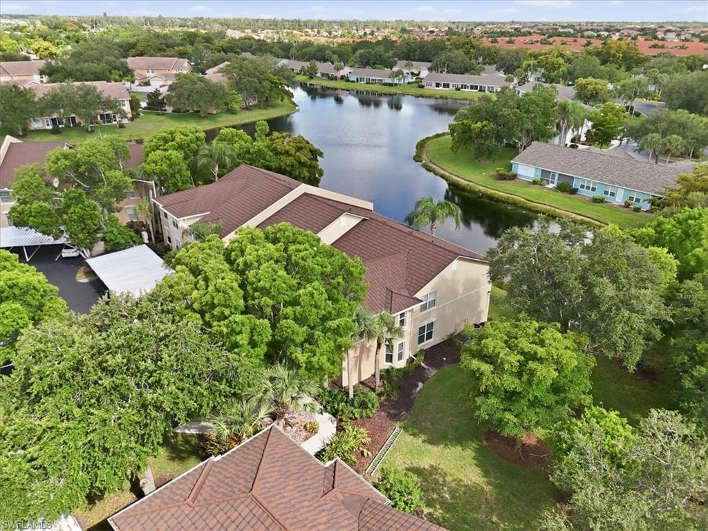 One or more photo(s) has been virtually staged, AI generated or rendered.  BEST DEAL UPGRADED LAKE VIEW CONDO in PARKER LAKES! Experience peaceful lakefront living in this stunning, top-floor 2BR+Den/2BA condo located in the highly desirable gated community of Bridgeway at Parker Lakes. This meticulously upgraded residence features soaring VAULTED CEILINGS that create a bright, open, and airy ambiance. The chef’s kitchen is fully modernized with premium QUARTZ countertops, top-tier stainless steel appliances, and custom SOFT-CLOSE CABINETRY complete with a built-in lazy Susan and spice rack. Luxury vinyl plank flooring (2025) flows seamlessly throughout. NO CARPETING. The primary suite offers direct lake views, lanai access, a WALK-IN CLOSET, and a spa-like en-suite with a dual-sink quartz vanity. The guest bathroom is equally upgraded with designer finishes. Major high-ticket updates provide ultimate peace of mind: a brand-new roof (2025), new A/C (2024), recent washer/dryer (2023/2025), a detached carport with a metal roof (2023). Relax on your south-facing screened lanai to enjoy glowing evening sunsets. Parker Lakes offers resort-style amenities including a lagoon pool, lap pool, spa, tennis, pickleball, fitness center, and walking trails. PET-FRIENDLY up to 35 lbs! One or more photo(s) has been virtually staged, AI generated or rendered.