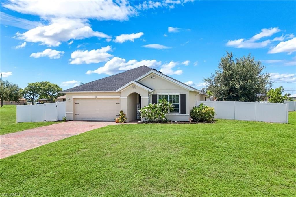 Welcome home to 511 NW 26th St, a beautifully maintained 3-bedroom, 2-bathroom home offering 1,671 square feet in Northwest Cape Coral. With a brand-new roof installed in 2024, this move-in-ready home offers peace of mind for years to come.
Inside, you'll find a bright, open layout with plenty of natural light. The kitchen features granite countertops, ample cabinet space, and overlooks the main living areas, making it ideal for everyday living and entertaining.
Step outside to a fully fenced backyard with plenty of room for pets, play, gardening, or simply relaxing and enjoying the Florida lifestyle.
Located in a growing area of Northwest Cape Coral, you'll enjoy easy access to shopping, dining, parks, boat ramps, and everything the area has to offer.