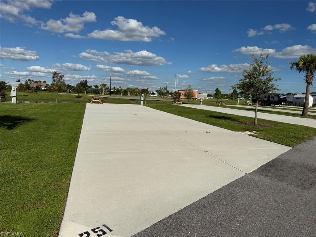 WATERFRONT RV PARADISE! DELUXE LOT 251 – RESORT-STYLE LIVING AT AN AFFORDABLE PRICE!

Welcome to Palm Breeze RV Resort in beautiful Punta Gorda, Florida! Discover your own piece of paradise with this spacious 40’ x 70’ deluxe waterfront RV lot offering gorgeous water views and plenty of extra room to create your dream outdoor retreat! Add a patio, tiki hut, outdoor seating, and tropical landscaping to make this space truly your own, subject to resort approval. Enjoy luxury resort living without the luxury price tag! This beautifully maintained community features immaculate grounds and outstanding amenities, including a heated swimming pool, hot tub and spa, fitness center, pickleball courts, putting green, shuffleboard, clubhouse, tiki huts, fire pits, dog park, playground, catch-and-release fishing, laundry facilities, and convenient shower and bathhouse facilities. Golf carts are welcome! Enjoy a full calendar of seasonal activities and social events while meeting new friends and embracing the Florida sunshine! Conveniently located just off I-75, minutes from historic downtown Punta Gorda, Fishermen’s Village, waterfront dining, boutique shopping, and entertainment. Punta Gorda Airport is approximately 2 miles away, with easy access to Fort Myers, Venice, Englewood, and Southwest Florida’s beautiful beaches. Monthly HOA fees are just $370! Rental opportunities are available, subject to community rules and restrictions. Whether you’re searching for a seasonal getaway, winter retreat, or investment opportunity, this waterfront lot offers endless possibilities! PRICED TO SELL QUICKLY! BRING YOUR RV, YOUR GOLF CART, AND YOUR FLIP-FLOPS! YOUR FLORIDA PARADISE AWAITS! Schedule your private showing today!