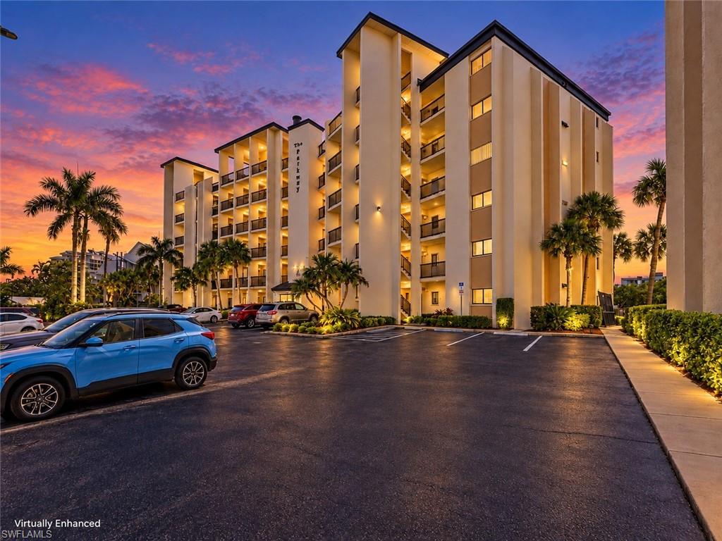 Oh What a View! Third-floor end-unit condo in The Parkway in North Fort Myers has gorgeous water views, an open floor plan, laundry hookup in unit, and a location directly along the Hancock Bridge Parkway corridor near the Caloosahatchee River. This spacious condo offers hardwood flooring, a modern kitchen with solid-surface countertops and breakfast bar seating, an updated guest bath, a Murphy bed frame in the guest bedroom, a primary bath with a spacious walk-in closet. HVAC replaced in 2023. The Parkway offers a heated pool with a waterfront view, BBQ areas, and a resident party room available by reservation. Waterfront restaurants, nearby marina boat-slip rentals, shopping, dining, the Downtown Fort Myers River District, beaches, and Southwest Florida International Airport are all part of the convenient Southwest Florida lifestyle. A trolley stop near the community provides easy access across the bridge to the River District’s restaurants, events, art walks, music, and waterfront atmosphere.