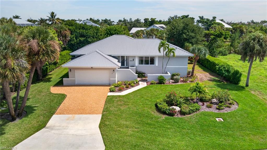 Enjoy the best of Sanibel living at 3312 Saint Kilda Road, a beautifully updated 4-bedroom, 3-bath pool home just across the street from the beach. With easy access to the sand and the privacy of your own backyard pool, this home offers the kind of relaxed island lifestyle that makes Sanibel so special.
Inside, warm wood beam ceiling details add character to the main living area, while thoughtfully selected finishes throughout give the home a fresh, refined feel. Large windows bring in natural light and capture peaceful lake views, creating a bright and inviting setting for everyday living.
Outside, the heated pool provides a private place to relax, entertain, or cool off after a day at the beach. A 5V metal roof adds durability and complements the home's coastal setting.
With four bedrooms and three baths, the home offers plenty of space for family and guests, whether you're looking for a full-time island residence, a Sanibel getaway, or a property with vacation rental potential. Here, days can easily move from the beach across the street to an afternoon by the pool, all from a place of your own on Sanibel.