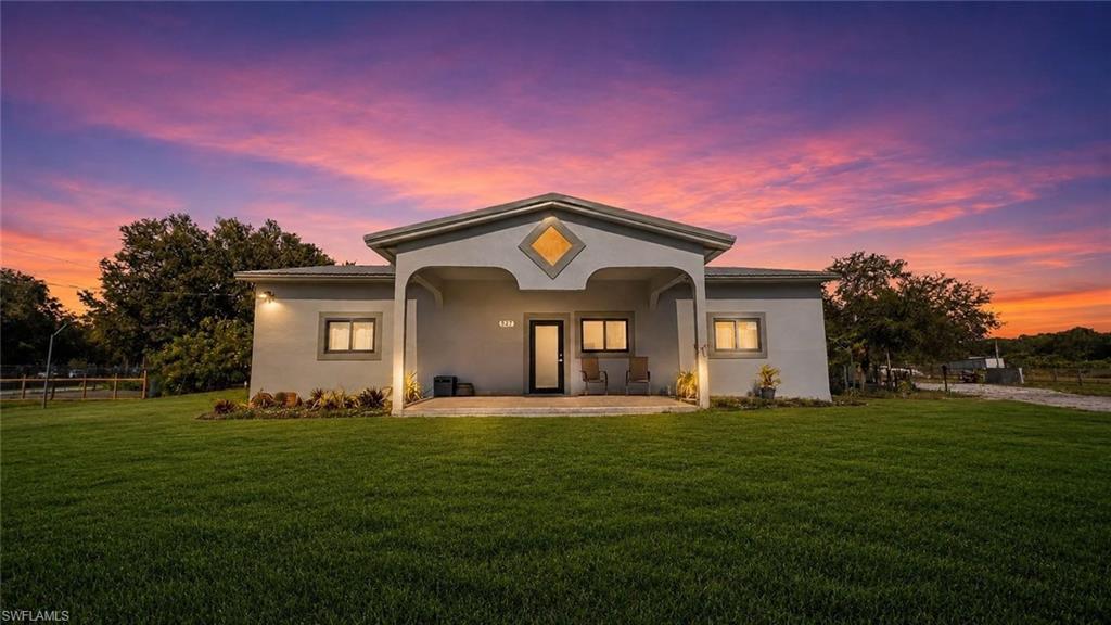 Beautifully remodeled single-family home on a peaceful 2.5-acre lot with plenty of space, privacy, and a true countryside lifestyle. The home features new porcelain tile flooring throughout, fresh interior and exterior paint, and a brand-new A/C system for year-round comfort. High-impact windows and doors provide added security, energy efficiency, and hurricane protection.

The fully fenced property includes two oversized gated entrances, allowing convenient access and enhanced privacy. A newly constructed 30' x 20' building provides endless possibilities for storage, a workshop, recreational use, or hobby space.

Equipped with a private well and septic system, this property helps reduce utility costs. Furniture is negotiable, making for a seamless move-in experience.

Enjoy the serenity of country living with plenty of room to expand, garden, entertain, or simply relax in your own private retreat while adding your personal touch to the outdoor spaces. Property is being sold AS-IS.