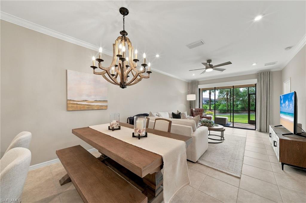 Experience effortless Naples living in this beautifully appointed first-floor end-unit residence in Esplanade Golf & Country Club, offering an exceptional combination of convenience, privacy, natural light, and expansive golf and lake views. Built in 2021, this light-filled condo features 2 bedrooms plus a den, 2 full baths, 1,632 square feet under air, and a detached 1-car garage.
The open and airy floor plan is enhanced by its desirable end-unit positioning, with additional windows in the den and bathrooms filling the residence with natural light. A sophisticated neutral color palette, crown molding, custom window treatments, upgraded chandeliers, and designer ceiling fans create a polished yet relaxed atmosphere throughout. The kitchen flows seamlessly into the main living and dining areas and features GE stainless steel appliances, making the space ideal for both everyday living and entertaining.
Step through the sliding glass doors and take in expansive views overlooking the lake and 15th green, providing a picturesque backdrop for morning coffee, afternoon relaxation, or evening cocktails. Motorized roll-down privacy blinds on the sliding glass doors provide added comfort and convenience when desired.
Ideally positioned on the first floor at the end of a quiet cul-de-sac, this residence offers easy, stair-free living along with an added sense of privacy. Combining newer construction, tasteful upgrades, abundant natural light, and a premier golf and water setting within Esplanade Golf & Country Club, this exceptional residence delivers the refined, low-maintenance Naples lifestyle buyers are searching for.
This property comes with a CLUB/SPORTS MEMBERSHIP, granting full access to all the amenities of Esplanade Golf & Country Club (limited golf opportunities all year round!).

Esplanade Golf & Country Club of North Naples is a true “Lifestyle Community” with something for everyone, including a resort pool with cabanas and the popular “Bahama Bar,” tennis, pickleball, bocce, a 14-mile network of bike/walking trails, and an 18-hole private golf course. The impressive 15,000 Sq Ft clubhouse features a restaurant, bar, wine-tasting room, wine lockers, and a Starbucks-style café. Don't miss your opportunity to own this exceptional home in one of Naples’ most sought-after communities. Schedule your tour of this stunning home and Esplanade Golf & Country Club today! COMING SOON TO ESPLANADE (2027): Fully renovated and expanded poolside Bahama Bar; expanded outdoor bar at the Barrel House; expanded golf practice range; fully renovated golf course; and an AIR CONDITIONED INDOOR PICKLEBALL COMPLEX with four indoor courts.