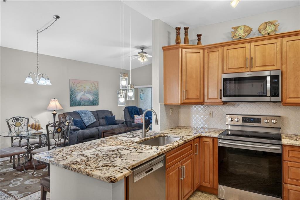 Welcome to 15441 Bellamar Circle #1123, a move in ready 3 bedroom, 2 bath second floor condo located in the gated community of Bellamar at Beachwalk in Fort Myers. This spacious residence features an open layout, volume ceilings, and a desirable split bedroom floor plan designed for comfortable everyday living or seasonal enjoyment. The kitchen offers solid wood cabinetry, granite countertops, tile backsplash, and stainless steel appliances, while the main living areas feature travertine and stone tile flooring with carpet in the bedrooms. Both bathrooms have been tastefully updated. Offered turnkey furnished, this condo is ready for immediate use and presents an excellent opportunity as a winter retreat, full time residence, or income producing rental property. Bellamar at Beachwalk is a gated community with attractive amenities, including a clubhouse, community pool and spa, fitness center, and well maintained grounds, all while maintaining relatively low HOA fees. The location is hard to beat. Just minutes from Fort Myers Beach, Sanibel Island, and the Gulf beaches, and conveniently close to Publix, Super Target, restaurants, and everyday shopping. A well maintained condo in a prime location offering comfort, convenience, and strong rental potential.