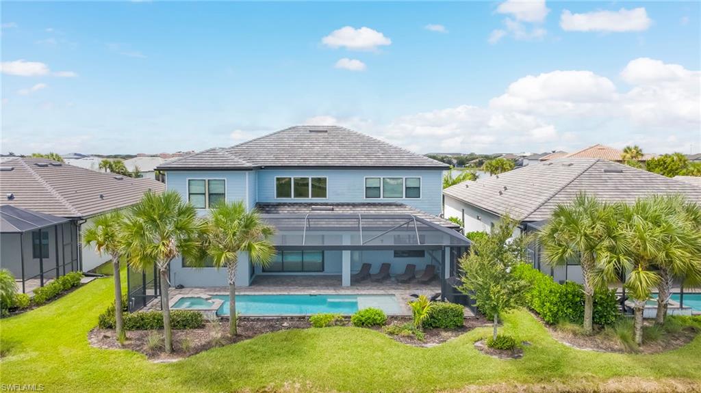 Luxurious Waterfront Living in Avalon Park! Situated on an extra-wide lot with sweeping pond views from both the front and back, this magnificent 5-bedroom plus bonus room, 5-bath Roseland seamlessly blends timeless elegance with high-end modern comfort.

A welcoming front porch overlooking the peaceful pond leads into a dramatic two-story foyer and soaring great room open to the second floor, accented by sophisticated oak-and-wrought-iron railings. Luxury vinyl plank flooring flows throughout the main living areas and into the impressive chef’s kitchen, featuring statement-making Big Chill retro-inspired appliances, an expansive island and a custom wine cave designed for entertaining. A large walk-in pantry, formal dining room and separate casual dining area provide exceptional space for everyday living and special occasions.

Pocket sliding glass doors open the great room to a custom outdoor retreat designed for effortless Florida living. The expansive lanai features an unobstructed picture-frame screen showcasing tranquil water and landscape views. Relax in the custom heated pool with an integrated sun shelf and spa.  There is also outdoor kitchen hook ups ready for your new kitchen installation!

Also located on the main level is an impressive 10' x 18'7" bonus room with French doors, offering flexible space for a home office, media room, fitness studio or guest retreat. A full bathroom, which also serves as the pool bath, is conveniently located just around the corner.

The spacious primary suite is a private sanctuary featuring an intimate sitting area and two generous walk-in closets. Two secondary bedrooms offer private en-suite baths, while two additional bedrooms share a Jack-and-Jill bath—providing privacy and functionality for family and guests. A generous three-car garage with epoxy flooring offers abundant space for vehicles and storage.

Enjoy beautiful front and rear pond views from this move-in-ready home in Ave Maria’s highly desirable Avalon Park neighborhood. Conveniently located near schools, parks, Town Center dining and shopping, this exceptional home offers luxury, space and an unbeatable location. Ave Maria is more than a place to live—it is a lifestyle filled with year-round events and a genuine sense of community that draws people from across the country.

Ave Maria—“Once you get here, you get it.”