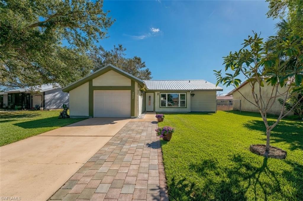 Move right in and enjoy this beautifully maintained turnkey home offering comfort, convenience, and thoughtful updates throughout. Ideal for first-time buyers, seasonal residents, or those looking to downsize, this inviting home features a new metal roof, tile flooring throughout, a spacious Florida room, covered porch, fenced yard, and many additional upgrades. The community offers a clubhouse and pool, and the location is hard to beat - within walking distance to Country Oaks Elementary School, Florida Southwestern State College, and the new LaBelle Sports Park.