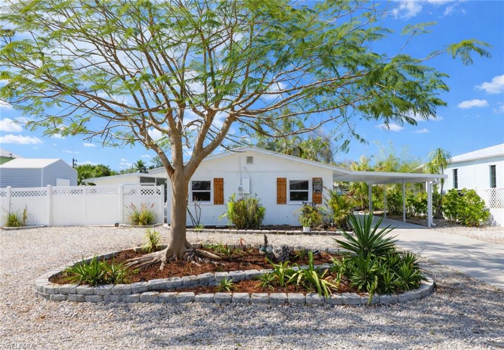 Whether you're searching for a waterfront investment opportunity, a seasonal retreat, or your future retirement home, this charming concrete block residence offers exceptional value and coastal appeal. Recent upgrades include a newer air conditioning system and a durable metal roof, tankless water heater, boat lift canopy, full kitchen and bathroom updating, providing comfort and peace of mind for years to come.
Inside, you'll find warm, character-filled walls and ceilings paired with crisp white finishes that create a bright, relaxed coastal atmosphere. This elegant, classic layout paired with Bahama shutters outside (and metal shutters for hurricane season) add both style and island-inspired charm.
Step outdoors to enjoy the oversized screened lanai—an ideal space for entertaining, relaxing, or dining while taking in the waterfront setting. The fully fenced backyard features a wide double gate, making it easy to store a boat, trailer, golf cart, or other recreational equipment securely on the property, this space has plenty of room to accommodate a future pool or hotub.
Boaters and anglers will especially appreciate the private boat lift with direct access to open water. Spend your days fishing, cruising, or exploring some of Southwest Florida's most sought-after destinations, including North Captiva Island, Boca Grande/Gasparilla Island, Cabbage Key, Cayo Costa, and the area's stunning Gulf beaches.
Whether you're looking for a full-time residence, vacation getaway, or income-producing property, this waterfront gem offers the perfect combination of comfort, convenience, and the Florida lifestyle.