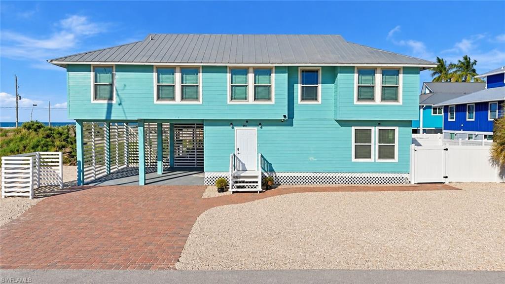 One or more photo(s) has been virtually staged, AI generated or rendered.  Bring your toothbrush, swimwear, and a smile—well, maybe also a T-shirt, sandals, and a pair of shorts if you plan to go out! 4 bed + Den / 3 full bath TURNKEY PROPERTY for sale! 700 feet from the beach! Only 700 FEET from the beach for that contemplative morning walk, play in the surf, soak up some sun, and end the day with another fantastic FMB sunset experience. They must’ve had this place in mind when “OPEN CONCEPT” was invented: The two upstairs bedrooms are split – one on each end of the home, with a vast open family, dining, and kitchen area in between! With tongue-and-groove woodwork throughout the upstairs living spaces finished in perfect beach colors, this home seamlessly blends updated building materials and technology with Oldé Florida Beach Cottage charm! Downstairs, you’ll find another bedroom and bath, plus an enormous flex space that can be your game room, media den, workout studio, yoga sanctuary, office—or all of the above! Step outside for poolside relaxation or rally the whole crew for a spirited game of water volleyball! Priced to sell and situated in the WEEKLY VACATION RENTAL ZONE, this property is an excellent opportunity for those seeking a beachside retreat with strong income potential. If you love the idea of kicking back on Ft. Myers Beach whenever you want—and earning rental income when you’re not here—this Ft. Myers Beach House is guaranteed to keep you smiling all year long!