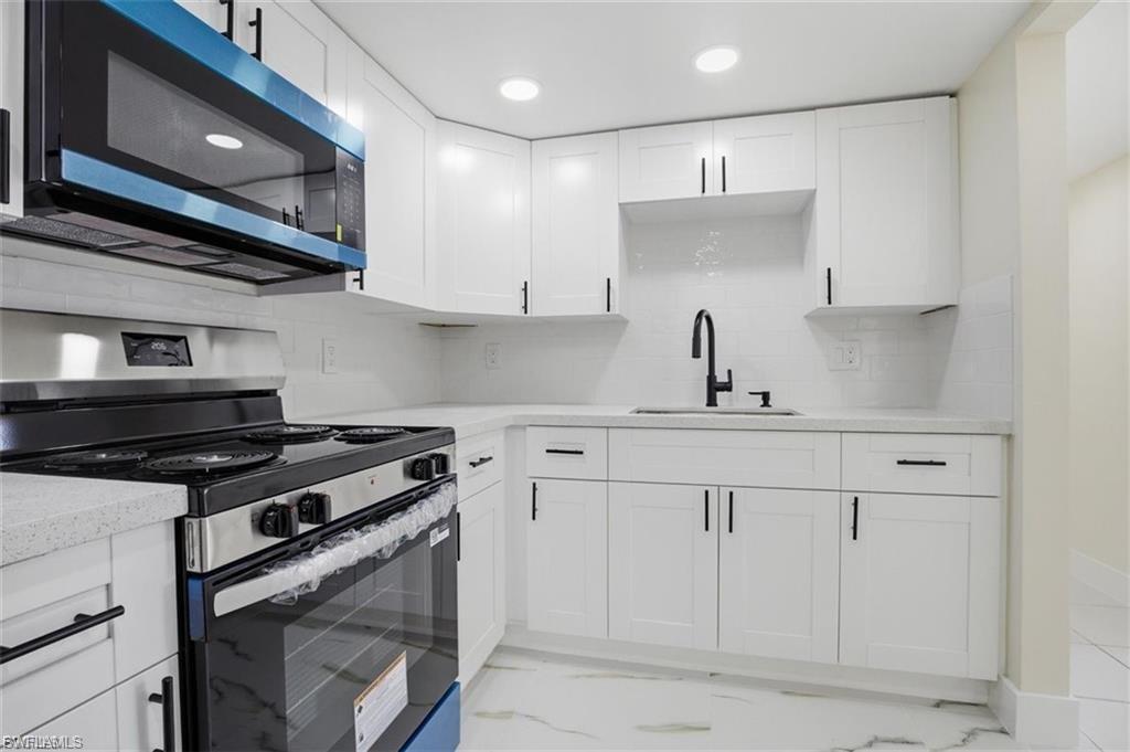 Welcome to this beautifully updated 2-bedroom, 1-bathroom condo at 3704 Broadway #205 in Fort Myers, offering the perfect blend of modern finishes, resort-style amenities, and income-producing potential. The completely renovated kitchen features crisp white shaker cabinetry, sleek quartz countertops, matte black hardware, and stainless steel appliances, creating a stylish and functional space for everyday living. Tile flooring flows throughout the entire unit, complementing the light, neutral color palette found in every room. The spacious living and dining area is bathed in natural light from sliding glass doors that open to a private screened balcony, ideal for enjoying Southwest Florida's year-round sunshine. Both bedrooms offer generous closet space and ceiling fans for added comfort, while the fully remodeled bathroom showcases a frameless glass shower, quartz vanity, and a modern backlit mirror. Residents of this well-maintained community enjoy an array of shared amenities, including a fenced heated pool surrounded by mature palm trees, an on-site fitness center equipped with cardio and strength-training machines, and a community clubhouse featuring a bar and lounge area, perfect for relaxing or entertaining. On-site coin-operated laundry facilities add everyday convenience. This unit is currently tenant occupied at $1,100 per month, making it an excellent opportunity for investors seeking immediate rental income, or an ideal option for buyers ready to move in upon lease expiration. Centrally located near shopping, dining, and major roadways, this Fort Myers condo combines updated style, community amenities, and everyday convenience. Schedule your showing today!