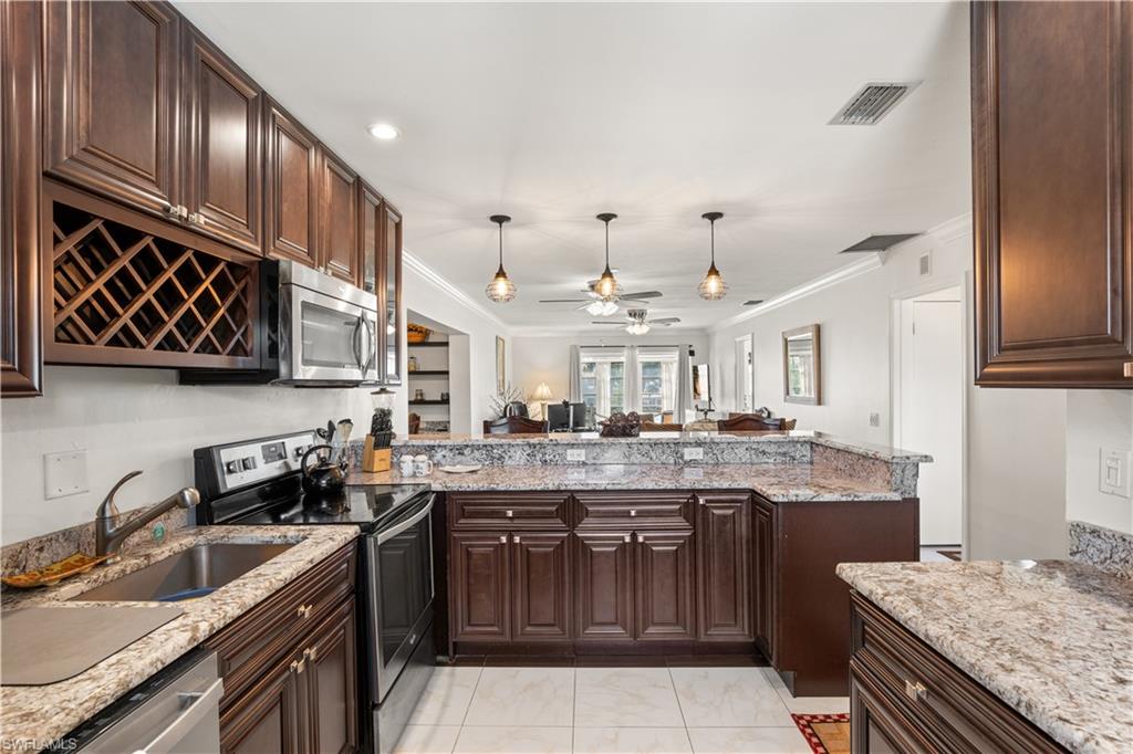 Enjoy easy Florida living in this turnkey furnished, second-floor corner condo, with no neighbors above, conveniently located just off Winkler Road in Fort Myers. This two-bedroom, two-bath home overlooks a beautifully landscaped green space and is close to local hospitals, shopping, dining the airport, Sanibel Island, and Fort Myers Beach.

Inside, the well-appointed kitchen features granite countertops, upgraded cabinetry, and a breakfast bar that opens to the main living area. A cozy nook near the living and dining areas offers a convenient space for a home office. Step through the sliding glass doors onto the balcony and enjoy the peaceful green-space view.

The condo is offered turnkey furnished, with the tenant’s personal belongings excluded. The current lease runs through December 31, 2026; buyer to assume the lease and enjoy the rental income. Don’t miss this opportunity—call today to schedule your showing!