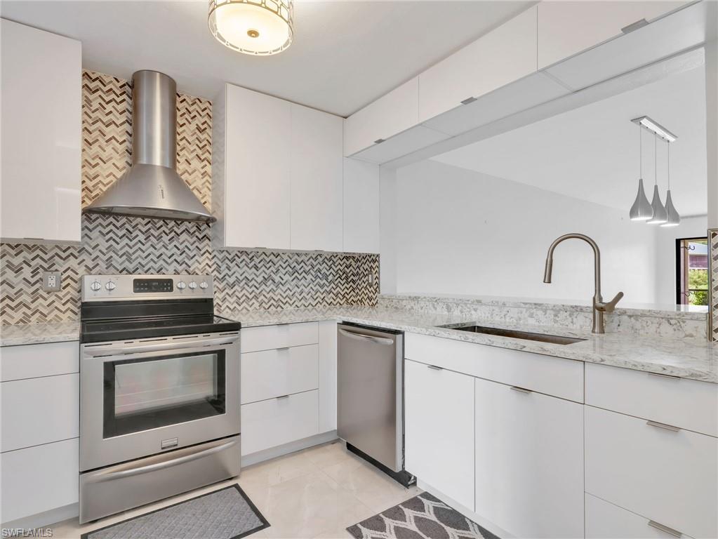 Discover the ease of Naples living in this beautifully maintained, move-in-ready, first-floor residence in The Abbey at Berkshire Village. Offering two bedrooms, two full baths, and a thoughtfully designed open-concept floor plan, this inviting condominium combines comfort, style, and convenience in an ideal Southwest Florida location. Natural light fills the living spaces, complemented by neutral finishes and tile flooring that create a bright, welcoming atmosphere. The tastefully updated kitchen features quartz countertops, crisp white cabinetry, stainless steel appliances, a contemporary backsplash, and a breakfast bar ideal for casual dining or entertaining. The spacious primary suite provides a peaceful retreat with generous closet space and a private ensuite bath, while the second bedroom offers comfortable accommodations for guests or the flexibility of a home office. Extend your living space outdoors, beyond the sliding glass doors, to the expansive screened lanai, where tranquil garden views and lush tropical surroundings create the perfect setting for morning coffee, afternoon relaxation, or unwinding after a day enjoying all that Naples has to offer. Additional conveniences include roll-down hurricane shutters, in-residence laundry, private lanai storage, assigned parking directly in front of the residence, and ample guest parking. Just steps away, the community pool offers a refreshing escape and an inviting place to enjoy Florida's beautiful weather. Ideally situated near the vibrant shopping, dining, and entertainment of Downtown Naples and Fifth Avenue South, as well as the area's renowned white-sand Gulf beaches, this location places the best of the Naples lifestyle within easy reach. Nearby Naples Botanical Garden, Sugden Regional Park, East Naples Community Park, and medical facilities add to the exceptional convenience. Whether enjoying a leisurely beach day, dining alfresco, exploring local parks, or simply relaxing in your own tropical retreat, every day offers an opportunity to embrace the Florida lifestyle. Perfectly suited as a full-time residence, seasonal escape, or investment opportunity, this charming condominium delivers an appealing blend of low-maintenance living, desirable amenities, and an exceptional Naples location.