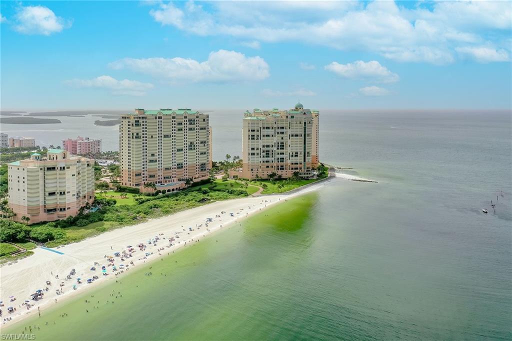 Enjoy spectacular views of Marco Island's entire Crescent Beach. Year-round sunsets from the expansive Gulf terrace, ideal for outside living and entertaining. Large east terrace for sunrise and morning sun. Several custom design features and floor plan enhancements add to the desirability and functionality of the spacious four-bedroom, four-bath layout.  Soaring 10-foot ceilings with floor-to-ceiling glass maximize the amazing beach & Gulf views.  Well-appointed and stylishly furnished. Quality features include stunning marble and warm wood flooring, coffered ceilings and decorative ceiling treatments, wainscotting, custom built-ins designed to integrate into the many quality aspects of the home decor and more. Elegant grand salon with fireplace and wet bar seamlessly transition to the outside living space for entertaining. The opened gourmet kitchen will delight the family chef with Sub-Zero and Dacor stainless appliances, gas cooktop, double ovens, warming drawer and center prep island. Luxurious primary suite affords Gulf and beach views, sumptuous bath area and large wardrobe closet. Three guest bedrooms plus fifth sleeping area provide plenty of space for all your visiting family and friends. Seller has started some updating projects, allowing the buyer to finish in their personal design style. Superb building amenities include lavish lobby with 24-hour front desk service, clubrooms, bar, billiards, business center, theater, guest suites, two pools and spas, convenient beach access and active social program. In prestigious Cape Marco, a private gated beachfront community. Cape Marco amenities include clubhouse, six Har Tru tennis courts, fishing boardwalk, paver sidewalks and a special Island lifestyle. The sounds of the surf, glorious sunsets and paradise awaits!