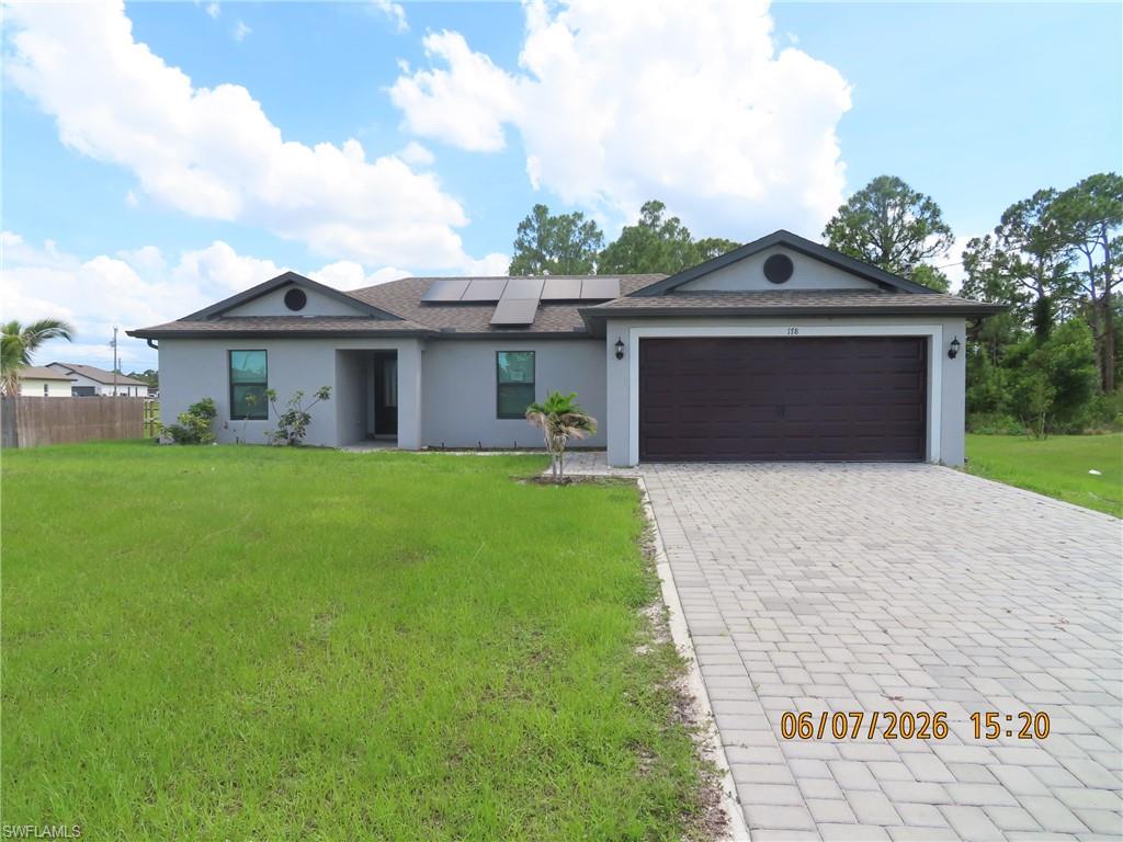 This stunning, move-in-ready house, built in 2022, boasts 1,461 square feet of modern living space, featuring 3 spacious bedrooms and 2 beautifully designed bathrooms. Enjoy the convenience of an air-conditioned laundry room and a stylish brick paver driveway that enhances the curb appeal. Nestled on a generous .26-acre lot, this home also includes a roomy 2-car garage, perfect for your vehicles and additional storage. Located in a vibrant community, you'll be just minutes away from local amenities, parks, and beautiful Gulf beaches. Don’t miss the chance to make this exquisite home yours!