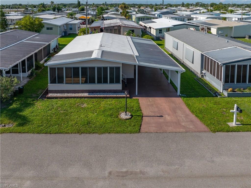 Welcome to 3374 Galaxy Way in the highly sought-after Phase 2 of Tamiami Village, a premier 55+ community in North Fort Myers. This beautifully updated 1982 manufactured home is move-in ready and includes a share certificate valued at approximately $11,500, offering added value to the new owner. 

Recent major updates include a 2023 TPO roof-over and 2023 A/C, providing peace of mind for years to come. Inside, you'll find new luxury vinyl flooring, with the subfloors new and vapor barrier repaired or replaced where needed. Most of the plumbing has been updated, along with a water heater approximately three years old, and new windows in the living room, master bathroom, and rear guest bedroom.

The remodeled kitchen features white shaker soft-close cabinetry, granite countertops, and new stainless-steel appliances, creating a bright and modern space for cooking and entertaining. Most of the home has been finished with sheetrock walls and ceilings, giving it the look and feel of a traditional site-built home.

Tamiami Village offers an active Florida lifestyle with outstanding amenities, including three swimming pools, two clubhouses, fitness room, library, shuffleboard, billiards, planned social activities, and more. Conveniently located near shopping, dining, downtown Fort Myers, medical facilities, and Southwest Florida's beautiful beaches, this home is an exceptional opportunity to enjoy affordable, low-maintenance living in a vibrant 55+ community.