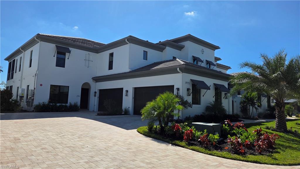 Introducing Nerano, a new coach home neighborhood by Front Door Communities located within the award-winning Miromar Lakes Beach & Golf Club. This limited collection features 10 buildings with four residences each. Will have 2 homes available for occupancy by May 2026, 3 more in August 2026 and 4 additional homes by December 2026. Act now and make your personal selections, choose your colors and finishes and make Nerano your new home or winter getaway! These designer-coach homes offers a private entrance, open-concept great room, volume ceilings, and a gourmet kitchen with large island. The floor plan includes 3 bedrooms and 3.5 bathrooms, a screened lanai with serene lake and preserve views, and an attached 2-car side-entry garage. Buyers may select from ground-floor or top-floor configurations Top floor offers a private den and private elevator as well as choose from a wide variety of available customization options. Residents of Miromar Lakes enjoy access to a 700-acre freshwater lake, 3 miles of white-sand beach, a 10,000 sq. ft. zero-edge infinity pool, three onsite restaurants, European spa and salon, fitness center, tennis, pickleball, bocce, racquetball, and the Arthur Hills Signature Championship Golf Course. Concierge services and an extensive lifestyle program complete this exceptional community. NOTE* The video/virtual tour provided represents a fully furnished model unit of the same floor plan. The actual available unit is sold unfurnished and may vary slightly in orientation, view, lighting, or specific finishes. Please contact the listing agent for exact details.