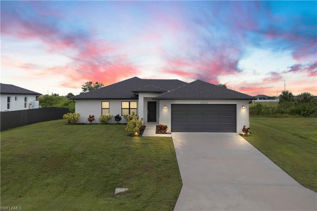 LIKE NEW 2023 WATERFRONT POOL HOME FEATURING SOUTHERN EXPOSURE WITH INTERSECTING CANAL VIEWS. Welcome to your Florida dream home! This nearly new 3-bedroom, 2-bathroom waterfront pool home, built in 2023, is packed with high-end finishes and sits on a premium southern exposure lot with gorgeous intersecting canal views—perfect for year-round sunsets and waterside relaxation.Step inside to an open-concept split-bedroom floor plan with vaulted ceilings and wood-look tile plank flooring throughout ideal for entertaining and everyday living. The designer kitchen features: All-wood white shaker cabinetry, Granite countertops, Stainless steel appliances, Large pantry and breakfast bar The spacious primary suite boasts a frameless glass walk-in shower, a generous walk-in closet, and serene water views. Each bedroom includes its own ceiling fan, and the oversized laundry room offers a utility sink and comes complete with a washer and dryer. Outdoor living shines here, with a covered under-truss lanai, clear-view screen panels, and concrete-backed patio pavers for added stability. Take a dip in the oversized saltwater pool, heated by a powerful 140KW electric heater, and enjoy peaceful days fishing, kayaking, or paddle boarding from your backyard. Additional Features: Hurricane-impact windows, sliders & doors, Security system, Full-yard irrigation system, Oversized lot with intersecting canal frontage, Southern rear exposure for optimal sunlight. Location Perks: Situated just seconds from the Crystal Lake Park which includes a lagoon-style lake with a beach, scuba diving, boat ramps, walking & biking trails, fitness stations, and more. Located in a beautiful, quiet residential neighborhood in NW Cape Coral, surrounded by new construction homes and just minutes to Burnt Store Marina. This is your chance to own a like-new, move-in-ready waterfront pool home in a fast-growing area—before prices rise!