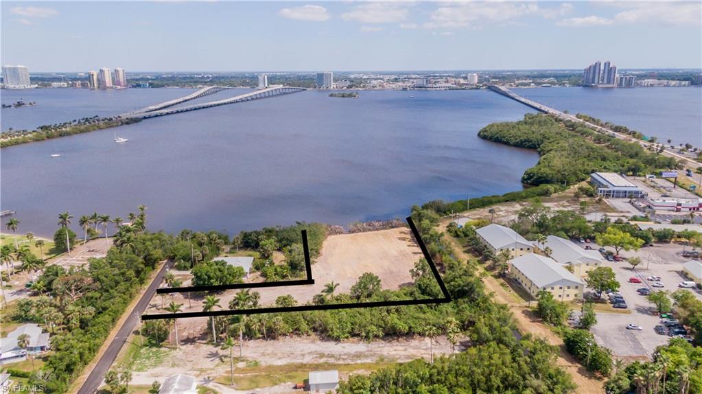 Rare Caloosahatchee Riverfront land directly across from Downtown Fort Myers! This cleared, filled waterfront property offers an incredible opportunity to build along one of Southwest Florida’s most recognizable waterways, with direct river frontage and expansive views of the Downtown Fort Myers skyline and Lofton Island.
Located at the end of River Road in North Fort Myers, enjoy direct Gulf access with no bridges, spectacular sunsets, and proximity to the River District, Marinatown, waterfront dining, boating, live music, and entertainment. Continued redevelopment around Legacy Harbour, Legacy Island, and Lofton Island adds even more excitement to this waterfront location.
With no HOA, an environmental study and survey available, and plenty of room to bring your vision to life, this is a rare opportunity near Downtown Fort Myers. Bring your builder and your vision—1059 River Road is ready for what’s next!