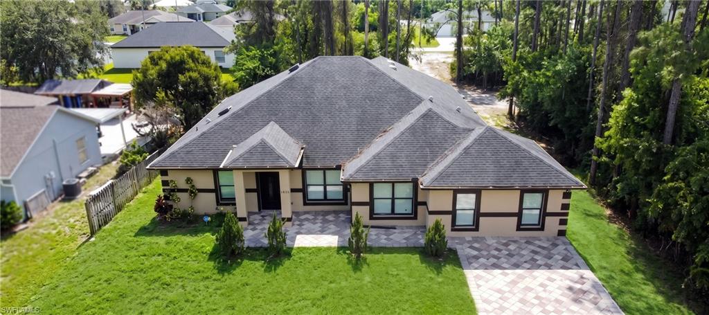 Welcome to this spacious, modern single-family home offering 3,752 sq ft of total living space built in 2019. Featuring 5 bedrooms, an office, and 3 full bathrooms, this home provides exceptional space and flexibility for large families or multi-generational living.  The interior showcases cathedral ceilings, updated ceramic tile and laminate flooring. The kitchen is outfitted with solid wood cabinets, quartz countertops. Designed for comfort and efficiency, the layout includes double A/C units, dual independent entrances, walk-in closets, and a 2-car attached garage. Situated on a 0.25-acre lot in a quiet neighborhood with easy access to local amenities and major roadways.