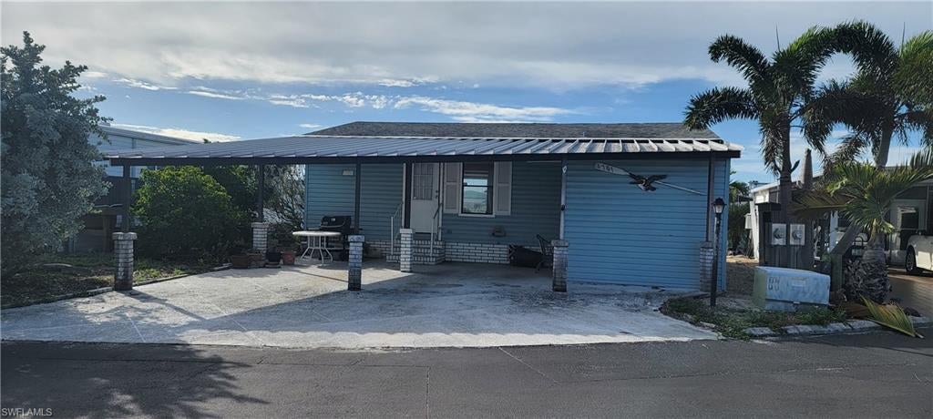Great Opportunity... This property is priced $25,000. below Lee County Assessed Value due to some handyman repairs needed, mostly on the out side of the home.  The 1987 manufactured home has been completely remodeled inside including new plywood floors, insulation, drywall, elevated mini splits systems, new kitchen cabinets, stainless steel appliances, new bathrooms remodeled and upgraded! This amenity rich community features an active Clubhouse with planned activities and a busy calendar of social gatherings, community pool with water aerobics, hot tub/spa, tennis, pickleball, shuffleboard, private boat ramp, boat storage, boccie ball, fresh water lake, fish cleaning station. Owned land, low fees, great location, Coconut Point Mall & the new Lee Health at Coconut Point are both 10 min away, close to Hertz Sports Arena, public golfing, between Naples & Ft Myers, close to FGCU, I-75 & SW Florida International Airport. This 1987 manufactured home was flooded by Hurricane Ian and has been gutted down to the framing studs, and plywood floors. The property comes with a Spring Creek Village Amenity Certificate Share worth $5,000. & the membership lowers the HOA fees. Estero Bay is 6 min by boat from the property with fishing, beaches, shelling, watching dolphins & waterfront restaurants. The Gulf is 15 min by boat via New Pass at Lovers Key Beach where boats gather in the Pass for the day, picnics, barbeques, swimming, shelling & watching tropical sunsets.