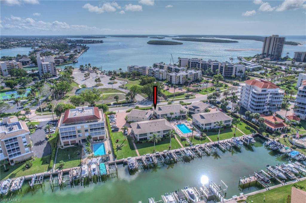 Small quiet complex with many long time owners. Located at Marco Island very desirable south end you will enjoy being very near the beach, boat ramp and ship store great for picking up some bait before heading out fishing for the day. The south end is a great place for walking, watching sunrise over Caxambas pass or heading out to see a movie or have dinner at one of the many nearby restaurants. Large picture windows overlook lovely pool area and sunsets and Marco skyline to the west. Le Club Caxambas condos are unique in that they are 2 condos up and 2 down allowing for windows on 3 sides. The bright inviting interior has some of the best use of space we have seen! Wide living room with enclosed sun room, large eat in kitchen, spacious primary suite and loads of closet space. Double vanity in primary suite with walk in shower. Assigned boat dock with very fast access to the Gulf of Mexico and the 10,000 islands.