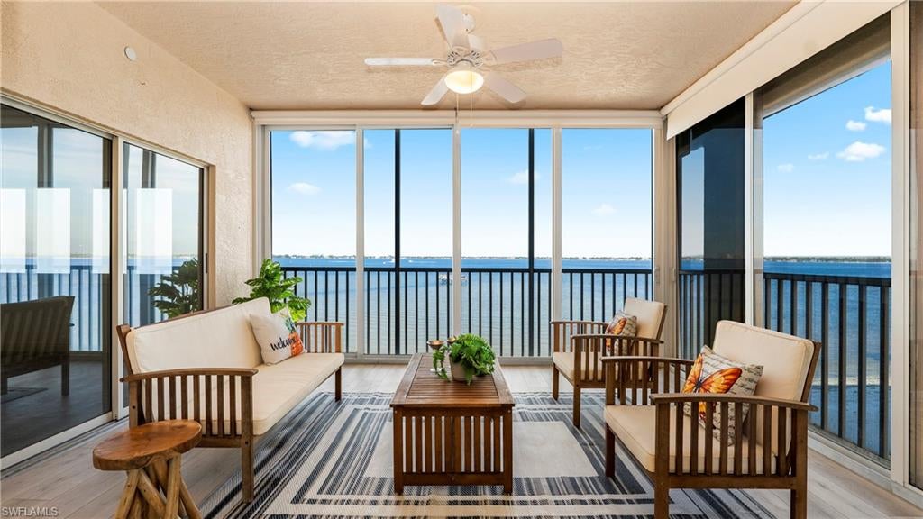 Welcome to Harbor Place, a gated community where refined waterfront living meets exceptional convenience. This stunning second-floor residence offers an open-concept floor plan with sweeping views of the Caloosahatchee River and unforgettable sunset vistas. A light-filled corner unit, the condo features three generously sized bedrooms and two well-appointed baths. Thoughtfully updated in 2026, the interior was reconfigured to enhance flow and functionality, including the removal of select kitchen walls, the addition of custom storage, durable vinyl plank flooring throughout the main living areas, and brand-new carpet in the primary suite and secondary bedroom. A private, secure elevator opens directly into the unit, and the community itself is gated for added peace of mind. Enjoy indoor-outdoor living with two private balconies, perfect for relaxing or entertaining. Residents also have access to resort-style amenities, including a resort-style pool with cabana and hot tub, BBQ picnic area and a private beach.  There is also a marina with optional boat lifts - for those who enjoy life on the water, and two additional pools, a fitness center, tennis and pickleball courts to suite your active lifestyle. Ideally located just minutes from Fort Myers’ renowned Gulf beaches, Harbor Place offers a rare combination of luxury, lifestyle, and location. This is an exceptional opportunity to call one of the area’s most desirable waterfront communities home.