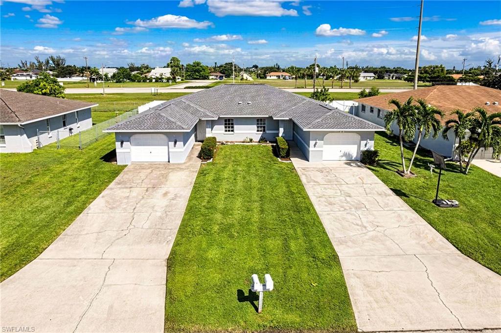 **INVESTMENT OPPORTUNITY WITH IMMEDIATE RENTAL INCOME AND A RENOVATED, MOVE-IN READY UNIT—NO FLOOD ZONE!**

Welcome to this spacious Cape Coral duplex, offering an excellent opportunity for investors and owner-occupants alike! Each unit features 3 bedrooms, 2 full bathrooms, a private garage, additional parking for two vehicles, a covered lanai, and a private backyard, providing comfort, privacy, and convenience.

**UNIT 1801** is currently leased at $1,750 per month, with a new lease in place through August 2027, providing immediate rental income.

**UNIT 1803** is beautifully updated, and move-in ready! Recent improvements include a brand-new kitchen with modern cabinetry, granite countertops, fresh interior paint, and an epoxy-coated garage and lanai floor, offering a fresh and inviting living space. Live in one unit while collecting rental income from the other, or maximize your investment potential by leasing both sides.

**MAJOR UPGRADE: NEW ROOF INSTALLED IN 2023!**

Conveniently located near shopping centers, restaurants, grocery stores, parks, schools, and everyday amenities, just blocks away from Women Premier Medical Offices, with easy access to Santa Barbara Boulevard and Veterans Parkway for convenient commuting throughout Cape Coral and Fort Myers.

Whether you're looking to expand your rental portfolio, generate passive income, or maximize your investment returns, this versatile duplex offers outstanding potential.

DON'T MISS THIS OPPORTUNITY! Schedule your private showing today!