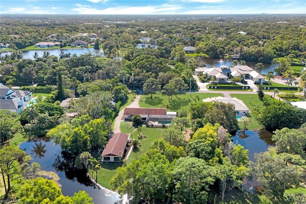 Flood Zone X, high and dry! Create something extraordinary on this 1.34-acre homesite in Naples’ highly sought-after Pine Ridge Estates. A peaceful pond backdrop and expansive grounds create a secluded retreat just minutes from the Gulf’s white-sand beaches. Build your dream estate or explore the possibilities for a luxury spec home in this coveted location. Enjoy convenient access to Clam Pass Beach, Mercato’s shopping and dining, Waterside Shops, and Artis—Naples, with downtown Fifth Avenue South a short drive away. The existing main residence and separate guest cottage offer flexibility with living or rental options while you plan your vision to create your dream estate. Space, serenity, and an exceptional Naples address—the perfect foundation for your next chapter.