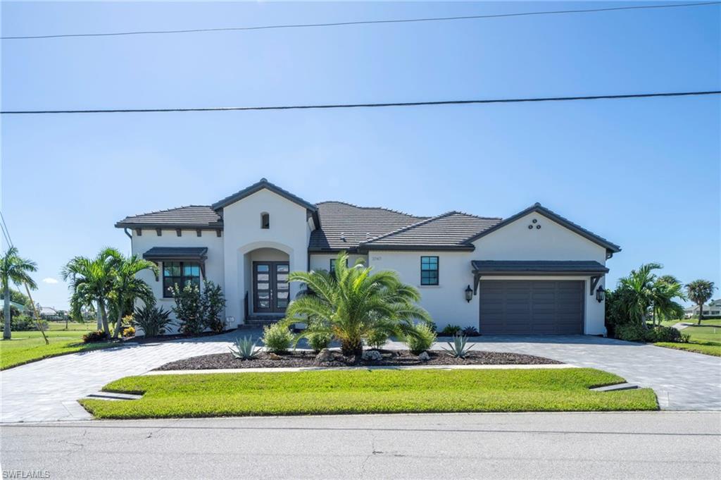 Welcome to 3747 Bal Harbor Boulevard, a magazine-worthy, never-lived-in, turnkey-furnished 3-bedroom, 3-bath pool home offering beautifully designed living space and sweeping golf-course views in Punta Gorda Isles. Built in 2023 and enhanced with exceptional upgrades throughout, it offers the appeal of new construction without the wait or expense of building and furnishing a comparable home today.

The light-filled interior features soaring ceilings coffered ceilings, recessed lighting and an open great room with custom shiplap feature wall, electric sunshades and expansive views across the lanai to the manicured fairways. Plantation shutters extend throughout the home and into the garage. Every closet features wood shelving, while a stone-accented wine closet provides an elegant focal point for holding your favorite wines for entertaining.

Indoor and outdoor living flow together beautifully. The screened lanai features a rich wood ceiling, electric fireplace, an outdoor kitchen and Storm Smart hurricane screens for comfort and protection. The private pool and upgraded enclosure by Upright Aluminum overlook the expansive golf course, creating a resort-style setting for morning coffee, sunset cocktails and year-round entertaining.

The home is offered completely turnkey furnished. All indoor and outdoor furniture, rugs, lamps and televisions remain, allowing the new owner to arrive with a suitcase and immediately enjoy the Southwest Florida lifestyle. Additional conveniences include a wall safe in the primary bedroom closet and a circular paved sealed driveway.

The residence is located along St. Andrews South Golf Club, a private, member-owned club featuring an 18-hole championship course, practice facilities, clubhouse dining and year-round golf and social activities. Optional membership is available separately and includes reciprocal opportunities at other area clubs. Golf membership is not included with the home.

Punta Gorda Isles residents may also join the Civic Association, offering a community center, more than 30 clubs and interest groups, fitness and educational classes, seminars, entertainment, community markets and social events. Nearby tennis is available through a separate tennis-club membership.

Punta Gorda is celebrated for its historic small-town atmosphere, Charlotte Harbor, boating and fishing, scenic walking and bicycling paths, waterfront parks and community events. Fishermen’s Village offers waterfront dining, boutiques, a marina, harbor cruises and live entertainment, while historic downtown features locally owned restaurants, shops, galleries and farmers markets.

With exceptional upgrades, sophisticated furnishings, a private pool, soaring ceilings and beautiful golf-course views, 3747 Bal Harbor Boulevard is truly move-in ready and better than new. No detail was overlooked and nothing was forgotten in creating this remarkable residence