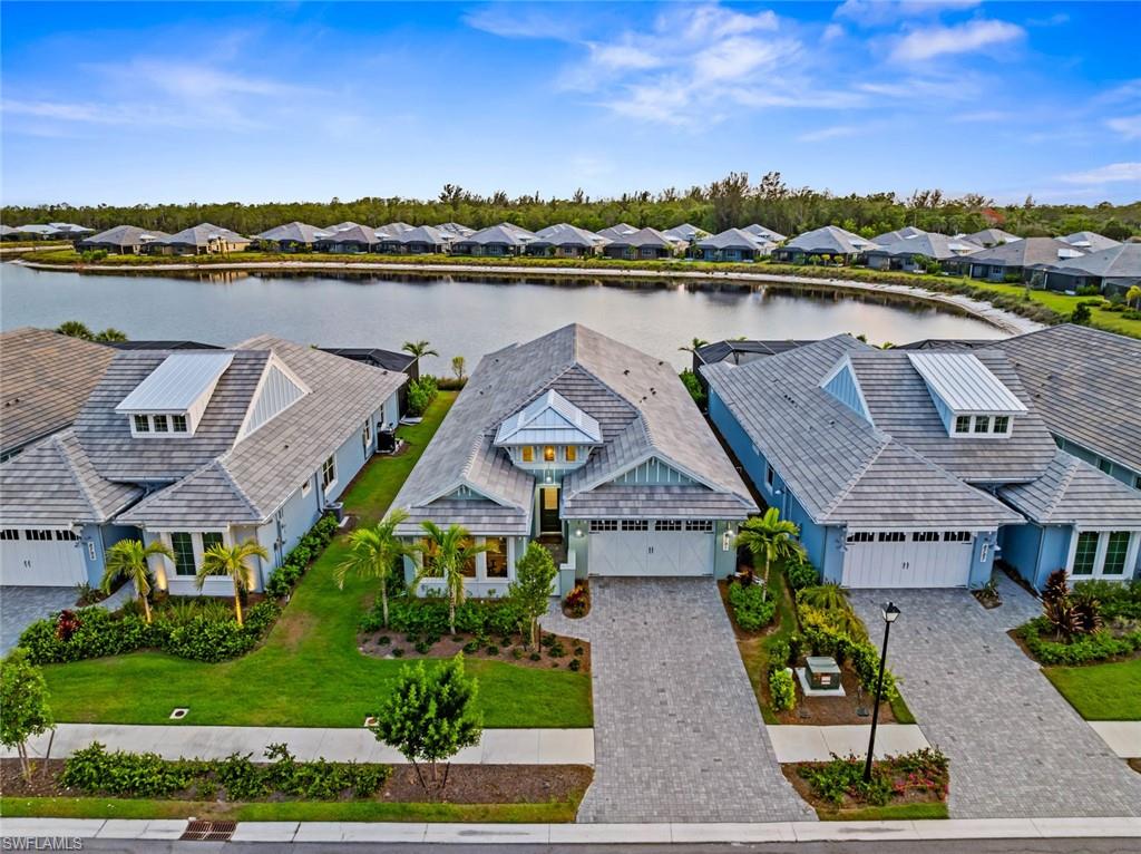 Pool/spa completion due for 1/21!! 8791 Calypso is a superb single family home, nestled in undoubtedly one of the most popular communities in Naples, and offers both expansive water and west facing sunset views!  This exceptional house includes a wealth of features and generous living room with high ceilings, upgrades galore, plenty of natural light and sense of space. A masterful fusion of modern coastal design and elegance, offering an extensive amenity-rich lifestyle with Pickleball, Tennis, Bocce, Fitness Center, Lap and Resort Pool, Restaurant, as well as miles of walking and biking possibilities.
On entering this home the key reception areas flow effortlessly from the welcoming hallway, into a fabulous great room with bespoke kitchen, offering plenty of storage, walk-in pantry, quartz countertops and central breakfast island. Dining and living areas with sliding doors opening onto the lanai and pool area, (fabulous pool is in the process of being built - estimated completion January 2026) provide for al-fresco or inside dining and entertaining for family and friends.  Four generous sized bedrooms, with the primary suite complete with built in wardrobes in the walk-in closets, and luxurious ensuite bathroom benefitting from dual vanities, walk-in shower and bath. Along with a fabulous study from which to work, there is also a good sized laundry room, powder room and integral double garage.
The Isles of Collier Preserve is located next to Naples Botanical Gardens, Naples Pickleball Center, Bayshore Arts District and Bayview Park, fun local restaurants including the Celebration Park and is also minutes from downtown Naples dining, shopping and white sandy beaches