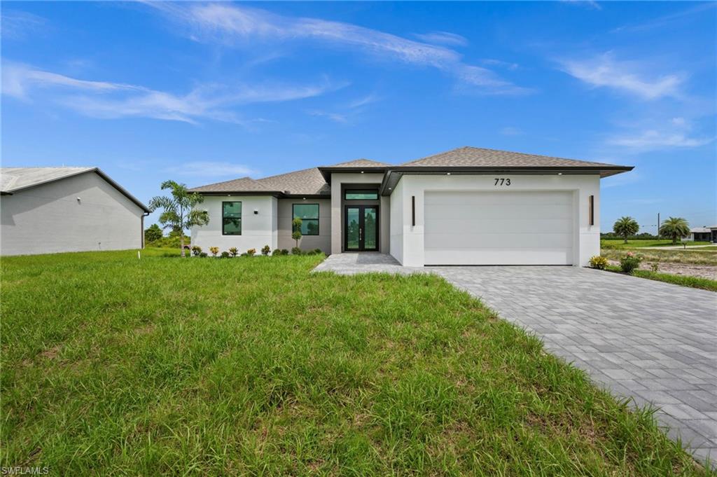 $10,000 TOWARD BUYER'S CLOSING COSTS!
 Spacious 4-bedroom, 2-bath, 2-car garage home spanning 2,005 sq ft with hurricane impact windows and doors throughout. Gourmet kitchen features stainless steel appliances, high-end cabinetry, quartz countertops and backsplash, and a waterfall-edge island. Master suite includes a spa-style bathroom with double sink vanity and frameless glass shower, plus dual walk-in closets. Oversized imported porcelain flooring and soaring ceilings run throughout, giving the home an elevated, modern feel. Beautifully landscaped garden with a covered lanai and extended driveway leading to the double garage entry. Quiet, safe street. Move-in ready — schedule your showing today!

See Virtual Tour URL for Property video
See Virtual Tour URL 2 for Tour inside the home