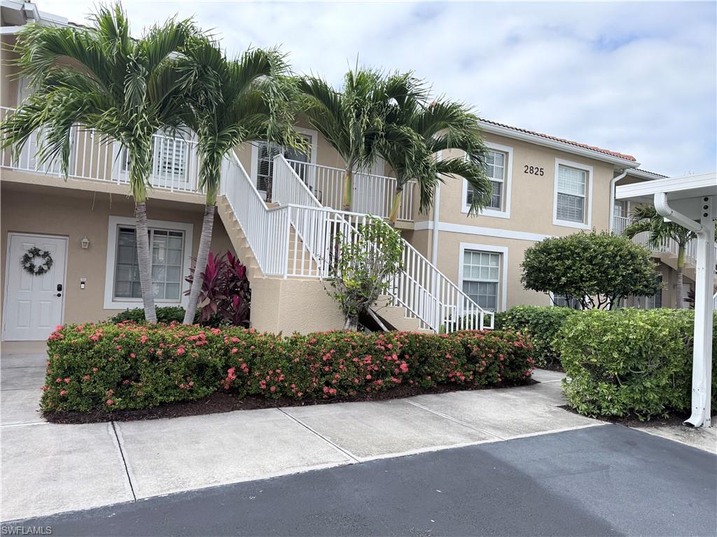 This condo has been redone with all new vinyl flooring throughout.  The bathrooms completely remodeled.  New appliances in the kitchen and partially furnished.  AC system replaced in 2019, Hot water tank 2020. Newer window treatments and five fans. Beautiful view of the lake and golf course with stunning sunsets.  Tile roof on building replaced after Irma.  Price was determined by recent comparable sales.  Bring your buyers they will not be disappointed.  Garden apartments are desirable because there are less units in the building.  Bundled golf membership included with every door.  New kitchen expansion, refurbished golf course coming soon.  Brand new bocce courts and 8 pickle ball courts.  Recently added more parking for members.