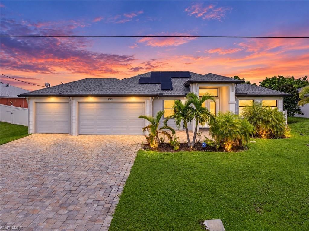 Welcome to 1213 SW 11th Ter! This beautiful and well-maintained 2023 Signus Signature Model offers just under 1,900 sq ft of living area and features 3 bedrooms plus a den, 2 bathrooms, a spacious 3-car garage, and a private screened-in saltwater pool.

Built with quality, comfort, and peace of mind in mind, this home features PGT hurricane-impact windows and doors throughout, eliminating the need for shutters. Step inside to a bright and inviting open floor plan featuring porcelain tile throughout the home, 8-foot interior doors, crowned tray ceilings with lighting, solid wood shaker-style soft-close cabinetry, stainless steel appliances, and beautiful quartz countertops throughout and reverse osmosis water filtration throughout 

The spacious primary suite offers sliding glass doors providing easy access to the lanai and pool area, along with two walk-in closets. The primary bathroom features dual sinks, a soaking tub, separate shower, and rainfall shower head.

Step outside and enjoy the Southwest Florida lifestyle from the screened lanai overlooking the 12' x 24' saltwater pool. An extended 18' x 45' paver pool deck provides generous space for outdoor seating, entertaining, and relaxing by the pool. The backyard is enclosed with a 6-foot vinyl privacy fence, providing additional usable outdoor space and privacy. The outdoor living area is also pre-plumbed and wired for a future outdoor kitchen.

Adding even more value is the fully paid photovoltaic solar panel system with battery backup, providing energy efficiency along with backup power capability. The spacious 3-car garage features an epoxy floor with decorative flakes for a clean, finished look.

City water and sewer are already in place with only a small remaining assessment balance.
