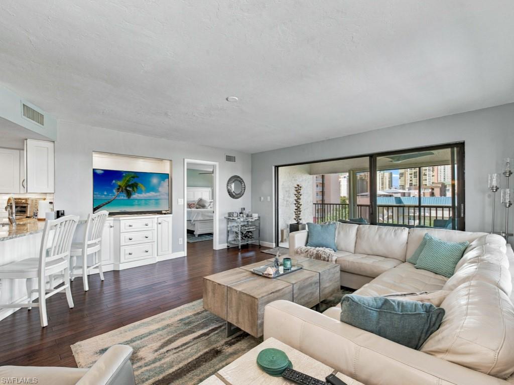 Discover the charm of island living in this spacious three-bedroom, two-bath top-floor corner residence at Casa de Marco, ideally situated at the desirable south end of Marco Island. Offering an abundance of natural light and a generously sized wraparound balcony, this inviting condominium provides the perfect setting to relax, entertain and enjoy beautiful western exposures and spectacular sunset skies. The thoughtfully designed interior features a remodeled kitchen, a spacious living and dining area, and a large pantry/storage closet for added convenience. Engineered hardwood flooring enhances the main living area and primary bedroom, while both guest bedrooms feature brand-new carpeting. Additional highlights include accordion hurricane shutters, covered parking and a private ground-floor storage closet. Residents enjoy a community swimming pool bathed in sunshine throughout the day, creating an inviting setting for relaxation. Ideally located just moments from Marco Island’s renowned South Beach, as well as nearby dining, shopping and entertainment, this exceptional corner residence offers the perfect combination of comfort, convenience and relaxed coastal living.