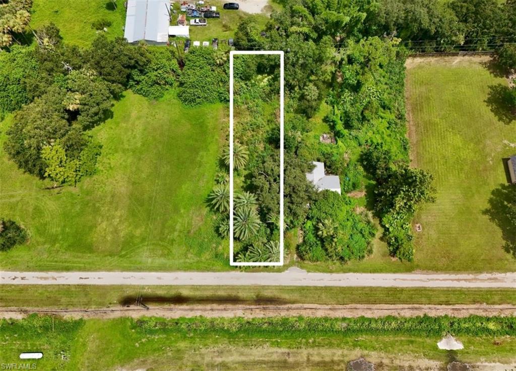 Prime 0.20-acre land opportunity in Lee County, located at 20101 Wagner Ave, Alva, FL. Situated in a peaceful rural area surrounded by working nurseries, greenhouses, and larger parcels, this property offers an open, low-density setting with plenty of natural character. The Caloosahatchee River is located nearby, adding mature tree cover and a quiet waterfront atmosphere, while the area's rural roads provide convenient access to Alva and surrounding communities.

A survey has been completed, and the property features an existing well, partial fencing, and a small pond at the rear of the lot. The seller also reports that approximately 100 dump truck loads of fill have been brought in to elevate the land. Buyers should independently verify the condition, quantity, placement, and permitting of any fill material, as well as the well, pond, and other site improvements, with the appropriate local authorities.

The property is located in Flood Zone AE, an area subject to a 1/100 annual chance of flooding according to current FEMA flood maps. Buyers should verify flood insurance requirements, base flood elevation, and any applicable building or development regulations with the appropriate local authorities prior to construction.

Zoned AG-2, the property is subject to Lee County land development regulations. Buyers should verify permitted uses, agricultural and residential development potential, setbacks, utility availability, environmental conditions, and all applicable development requirements with Lee County before purchasing.

The property is available for a self-guided tour. Subleasing is not permitted. This lot is not available for rent or lease.