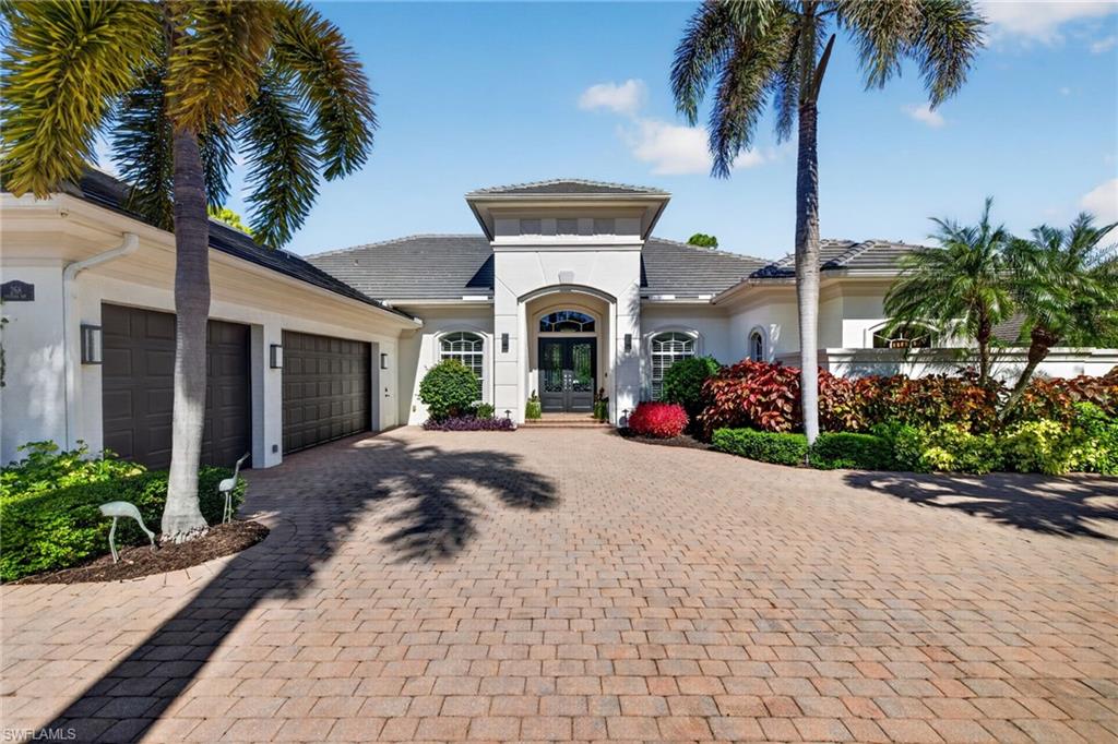 The Florida lifestyle at its best. Indoors meets outdoors seamlessly from the updated kitchen and spacious living areas through open zero-edge sliding glass doors to the luxurious newly installed marble lanai and pool deck, newly renovated and heated saltwater pool, and spa framed by tropical landscaping. This oasis provides a stunning view of nature and the golf course, while maintaining privacy. The spacious master suite, with dual showers, vanities, and walk-in closets opens to the lanai through French doors. The three guest bedrooms, all with en-suite baths, occupy their own area of the house, separated from the living and kitchen areas and master suite. A dedicated office and a powder room that opens to the lanai and pool areas complete the living spaces. In addition to providing an ideal environment for living, entertaining, and hosting guests, the home offers an array of special features. A solar power system (installed on a new roof) with battery backup provides freedom from electricity bills along with electricity to run the home during power outages without the cost and maintenance of a generator. Newly installed Magna-Track hurricane-rated screens, operated by remote or app, protect the house and lanai while offering privacy or shading if desired. Other amenities include a garage with six car capacity, a Sonos sound system, a large laundry room, a fenced dog run, an outdoor pool shower, a central vacuum system, and a Kinetico water treatment system. The amenities extend from the home to those offered by the prestigious Audubon Golf and Country Club, a rare gem located west of U.S. 41. The scenic community spreads across 755 acres, with 58% certified as a nature preserve and 28 lakes woven throughout. In addition to the Joe Lee signature 18-hole golf course, recreational amenities include renovated tennis, pickleball and bocce courts, and croquet lawn; a heated lap pool; a 10,000 square foot fitness center; and a kayak launch area on Little Hickory Bay at the end of a scenic Boardwalk through wetlands adjoining the bay that is walking distance from the home. The poolside café offers indoor and outdoor dining while awaiting the completion of a stunning renovation of the main clubhouse. Redefined, private, and thoughtfully curated at every turn, this property perfectly suits those who expect nothing less than exceptional.