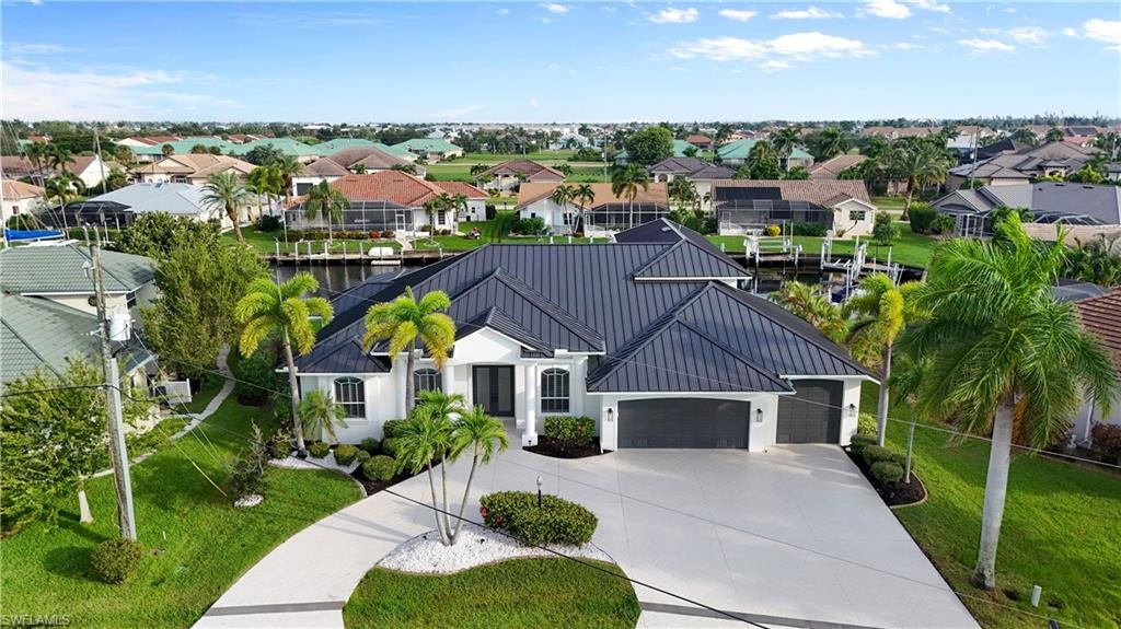 BOATER’S DREAM IN PUNTA GORDA ISLES! Welcome to 1506 Casey Key Drive, an updated 5-bedroom, 4-bath waterfront pool residence offering 3,068 square feet of living space, a spacious 3  1/2 car garage, and direct sailboat access with no fixed bridges between you, Charlotte Harbor, and the Gulf of Mexico.

Positioned along approximately 90 feet of saltwater canal frontage, the property features an approximately 427-square-foot concrete dock perfect for keeping your boat just steps from your back door. Spend your mornings fishing, your afternoons cruising Charlotte Harbor, and your evenings returning home beneath a Southwest Florida sunset.

Inside, the generous floor plan offers an impressive combination of comfort, flexibility, and space for entertaining. Premium luxury vinyl plank flooring flows through the main living areas, while the customized kitchen and beautifully updated bathrooms bring a fresh, modern feel to the home. The expansive living room provides plenty of room to gather, and the built-in audio and intercom system adds convenience throughout the residence. With five bedrooms and four full bathrooms, there is abundant space for overnight guests, a home office, hobbies, or multigenerational living.

Step outside to an expansive screened lanai overlooking the canal, where the pool and connected spa create your own private waterfront retreat. Whether you are hosting friends poolside, relaxing after a day on the water, or simply enjoying the peaceful canal setting, this outdoor space captures the Florida lifestyle buyers come to Punta Gorda Isles to experience.

The oversized 3 1/2 car garage provides valuable space for vehicles, boating equipment, and additional storage. With no mandatory HOA fees and convenient access to Fishermen’s Village, historic downtown Punta Gorda, waterfront dining, shopping, and community recreation, this home brings together space, modern updates, and exceptional boating access in one remarkable waterfront property. Your next adventure begins right in your own backyard.