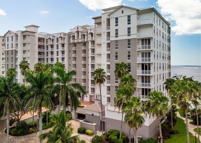 Gorgeous Remodel that's Loaded with Custom Features, this Top Floor Penthouse is like New Throughout with No Detail Overlooked! Country Club Golf Membership negotiable, assessment paid. Spectacular River Views, 2 Waterfront Lanai's + Guest Suite Balcony overlooking the Golf Course. The Bright Entry Foyer features a Glass Leaded Door and Custom Framed Mirrors on Both Walls. Penthouse Ceilings in Foyer, all Living areas, Dining Room and Kitchen have Custom Recessed Lighting and Crown Molding. Kitchen is All Custom opened up for Water Views with Gulfshore Woodworks Cabinetry, Quartz Counters, Thermador Stainless Appliances, Induction Cook Top, Top Oven is also a Steam Oven as well as Convection and there’s a Waterfront Dinette. Tastefully Painted Wood Cabinetry features a Hidden Refrigerator-Freezer, Pantry, Pull-out Shelves, extra Cabinets Facing both the Dinette and Living room and Breakfast Bar. Large Lanai runs from the Dinette to the Formal Living Room that features a Custom Stone enclosure for Big Screen TV, Electric Fireplace that Generates Heat if desired and Shelving with Indirect Lighting. The Formal Dining Room also Features Custom Woodworking with China Cabinetry, Mirrored Backsplash behind Serving Counter plus Wine Cooler and Refrigerator. The Primary Suite has A Double Tray Ceiling with Crown Molding overlooking the Water and has its own Private Waterfront Lanai.  Primary Bath also has Comfort Height Custom Cabinetry with Quartz Counters, Large Shower, Bathtub, Vanity Desk and Two Closets. Both Guest Suites also have Double Tray Ceilings and one is a Suite with a Private Bath, His and Hers Sinks, Quartz Counters and Custom Comfort Height Cabinetry plus a Big Walkin Closet. The Guest Bathroom also has matching Custom Wood Cabinetry and Shower with Tile Surround, the Hallway to the Guest Bedrooms is Opened Up creating a foyer feel. There is Beautiful Travertine Tile all Living Areas and Lanai's, Plank Wood Flooring all Bedrooms, 8' Solid Core Doors, Custom Baseboards, Storm Shutters  both Lanai's and the Guest Balcony and there is a Renewaire Air Filtering System, a Storage Locker, a dedicated Parking Spot plus Loads of Guest Parking for your 2nd vehicle,  The Community Pool-Spa is On The River and is Adjacent to Boardwalk to the Marina and Country Club
