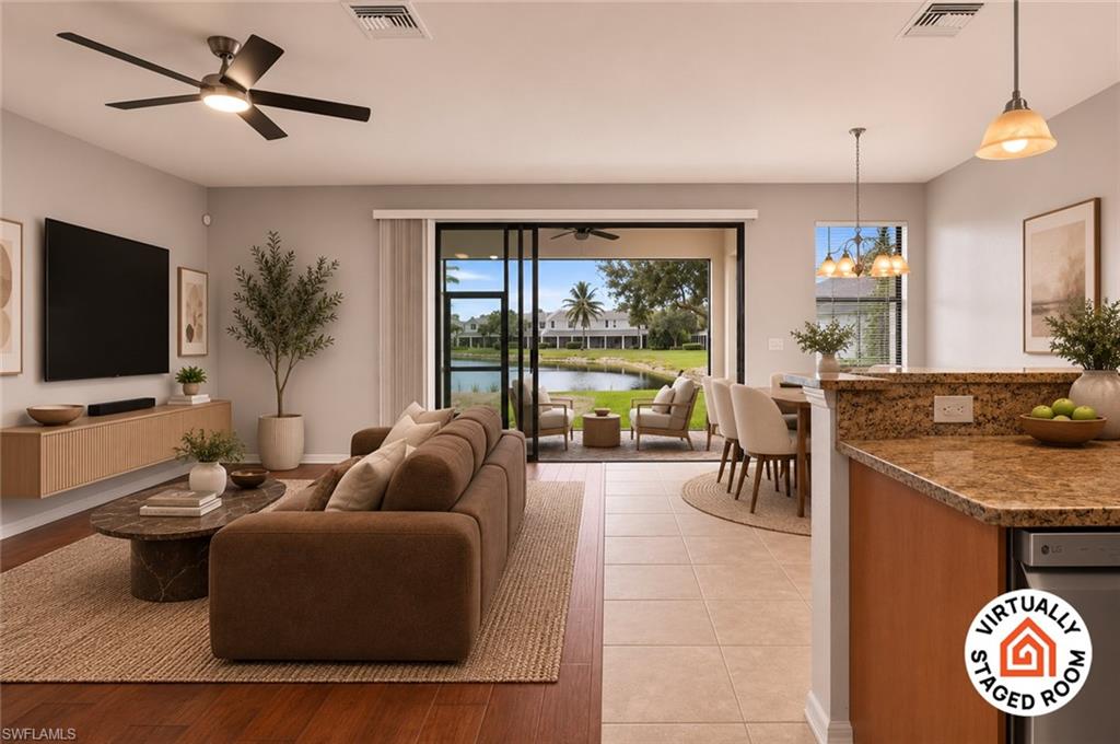 Southern-exposure lake views and move-in-ready condition make this beautifully maintained 3-bedroom, 2.5-bath townhome in Summit Place stand out. At 1,800 square feet with a large 2-car garage, the carpet-free interior features tile and laminate flooring throughout. The open living and dining area extends to a screened lanai overlooking the lake — ideal for morning coffee or evening relaxation. The kitchen offers 42-inch cabinetry, granite countertops, and pantry storage. Upstairs, the primary suite includes a walk-in closet and private bath with dual vanities and a separate shower; two guest bedrooms, a full bath, and upstairs laundry provide everyday convenience, with additional storage beneath the stairs. Summit Place residents enjoy gated access, a resort-style pool and spa, clubhouse, fitness center, sauna, pickleball and tennis courts, basketball, playground, and picnic area, with cable and internet included in the HOA fees. Minutes from Founders Square, Mercato, I-75, shopping, dining, and Gulf beaches, this North Naples home offers an exceptional combination of view, condition, location, and value.

Select images have been virtually staged and/or enhanced using AI-generated or rendered furniture.