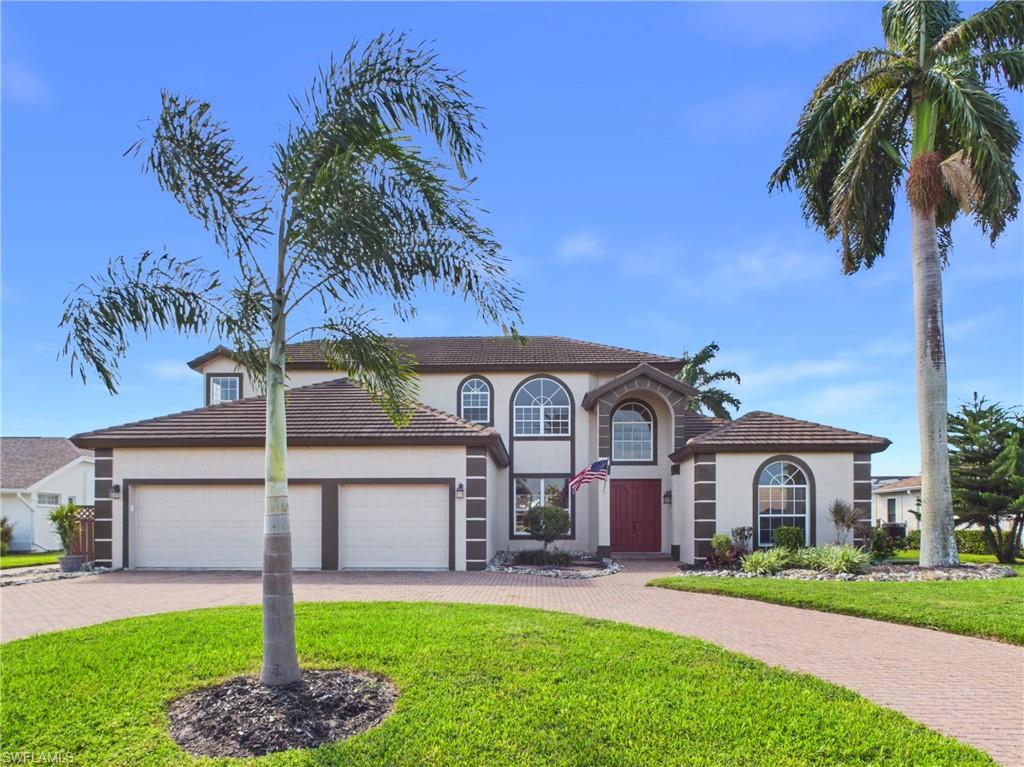 Golf Course Vistas, Shimmering Lake Views and Elevated Living in Spanish Wells

Some homes impress the moment you walk in. This one keeps impressing long after you step outside. This two-story Spanish Wells residence pairs dramatic two-story ceilings with sweeping golf course and lake views, bringing the beauty of Southwest Florida into every day.

The first-floor primary ensuite is a peaceful retreat with elegant crown molding and a relaxing soaking tub. Near the living room and kitchen, a dedicated wine bar or coffee station adds a little everyday indulgence, along with newer kitchen appliances.

Outside, the oversized lanai is made for gatherings and slow afternoons by the private pool. It has a pool bath, an outdoor shower and a pre-plumbed space ready for the outdoor kitchen you've been picturing. Upstairs, a private balcony frames the lake and golf course, so even a quiet morning feels special. A 3-car garage gives you room for vehicles, golf carts and all your gear.

With its striking architecture, inviting places to entertain and scenic setting, this Spanish Wells home is made for enjoying the Southwest Florida lifestyle. Shopping, dining, golf and the Gulf Coast beaches are all nearby.