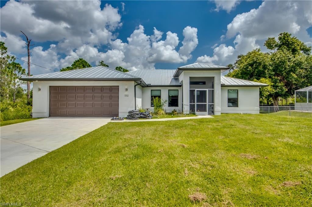 BACK ON THE MARKET - BUYERS FINANCING FELL THROUGH, THEIR LOSS YOUR GAIN! MOVE IN READY HOME WITH ALL THE BELLS AND WHISTLES! Welcome to this almost brand-new construction property (2021) in the growing Lehigh Acres community. This beautiful 3 bedroom / 2-bathroom home has an open concept kitchen with all stainless-steel appliances, granite countertops, upgraded kitchen hardware, breakfast bar & solid wood cabinets. The wonderful layout includes a split floor plan for privacy as well as an open concept which allows for a seamless transition from the living area to the dining room. The spacious master suite has access to the patio, large walk-in closet with custom closet inserts and a master bathroom with dual sinks and walk in shower with glass enclosure. The upgrade list of this home is endless! Security Cameras around the entire home, screened in back and front porch, Custom built pantry in Laundry Room, Cabinets above washer & dryer, 20x20 porcelain floors, brushed satin upgrade lighting package - the list goes on! Why wait on new construction when you can have an almost new home with many upgrades!