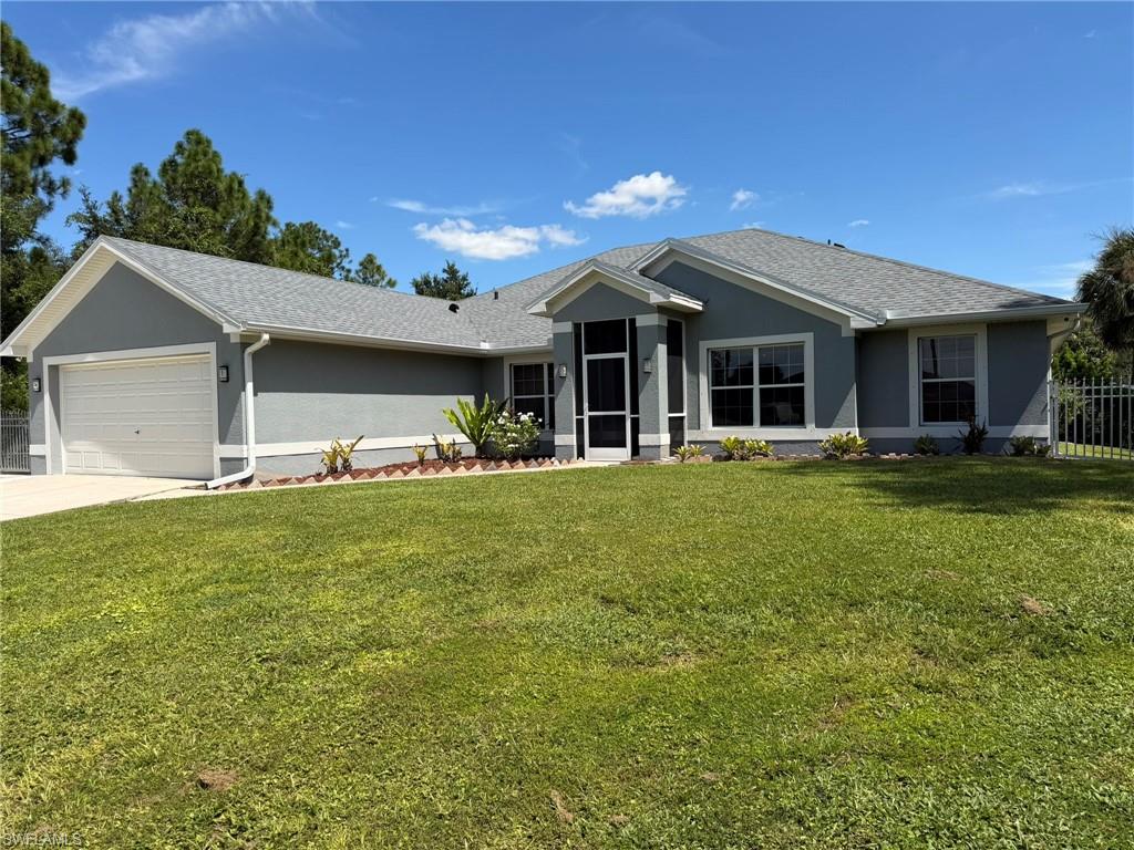Your Florida dream home awaits! Move right into this beautifully updated Lehigh Acres retreat, where spacious living, modern upgrades, and resort-style outdoor entertaining come together. Featuring 4 bedrooms, 2 bathrooms, and 2 flexible dens, this home offers room to live, work, and relax. Enjoy tile flooring throughout, a stunning kitchen with custom cabinetry and marble countertops, and a luxurious primary suite with a soaking tub and walk-in shower. Step outside to your screened-in, heated pool with a waterfall feature, expansive paver lanai, pergola, and additional outdoor entertaining space. A 12x16 air-conditioned detached office adds the perfect work-from-home setup. Major updates include a new roof (2024–2025), well pump (2025), reverse osmosis system (2024), and pool cage screens (2023). With full fencing, hurricane shutter panels, custom closet built-ins, and numerous added conveniences, this property delivers the space, privacy, and Florida lifestyle buyers are looking for!
