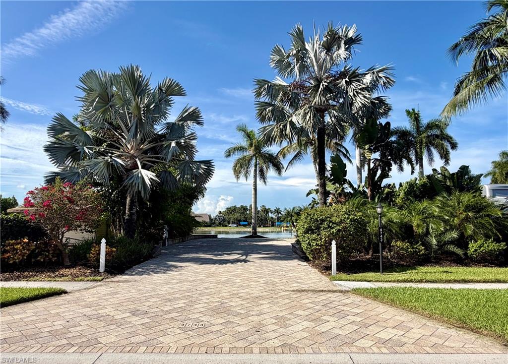 Site Details: 
Lake front Class-A Motorcoach site located in Pelican Lake Motorcoach Resort.  This site is centrally located near the middle of the resort with a wide open lake view with the clubhouse in the distance.  Pull-in to this south facing property and enjoy the view of the lake and fountains.  Completely upgraded with a paver pad and extended patio and tropical landscaping surrounding the site.  There is an outdoor bar with grill.
Coach house Details: 
The 10X10 coachhouse has recently been finished with a new hardy board exterior and new tile type roof.  Finished on the interior with shower, vanity with sink, toilet, and new stackable washer & dryer.  The floor is a ceramic tile.