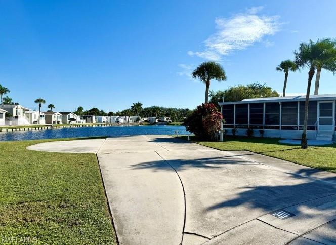 Thank you for viewing 351 Bobcat Run, a lot for sale in the Imperial Wilderness Condominium Association of Naples, Florida. IWCA is a gated, 55+ community that was never flooded. The community is located approximately 3 miles from shopping and restaurants, 11 miles from the Naples beaches, 8 miles from Marco Island beaches, and approximately a 45-minute drive from Ft. Myers. This vacant lot, situated on the water, is .08 of an acre. In addition to some grassy space, it is a rectangular concrete slab with an additional curved concrete extension. The lot features water, sewer, and electrical hook-ups. It is able to accommodate a manufactured home or RV (maximum 40’). It is the perfect spot for seasonal, full-time, or a rental residence. The HOA fee is very reasonable ($898. per quarter) and covers many of your needs: water, lawn care, basic cable, trash/recycling, and community amenities. Beyond the security of a gated 55+ location, there are numerous community amenities: 2 pools with spas, a nature trail, pickleball, tennis, horseshoes, bocce, pétanque, memorial garden trail, 2 dog parks (there is a 1 pet, 40lb. max., restriction), and the ability to drive a golf cart within the park. On top of everything, IWCA offers a phenomenally active social events calendar.