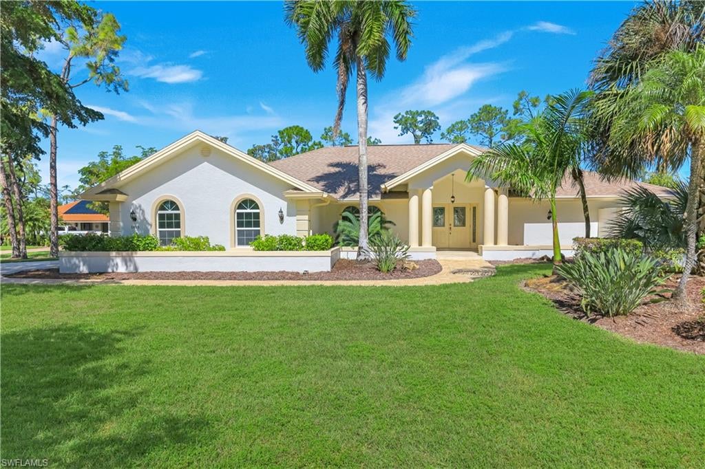 One or more photo(s) has been virtually staged, AI generated or rendered.  Open and spacious 3 bedroom pool home with lush tropical landscaping on a half acre lot.  This property has tons of room for everyone.  Large neutral tile throughout. Upgraded soft close cabinetry, granite and Kitchenaid stainless steel appliances in the kitchen. A prep island is perfect for the cooks and there are pull outs in the pantry cabinet and most lower cabinets.  A walk-in pantry is perfect to store all your small appliances and there is a separate area perfect for a coffee bar.  Tons of Impact windows and doors bring natural light inside.  The owner's suite has 2 oversized walk-in closets, a large linen closet and spacious bath.  Dual sinks with granite and lots of drawers plus a large shower with natural light.  Beautiful and timeless travertine pool deck set an upscale area around the pool with a water feature.  A powder bath and outdoor shower are dedicated to the lanai.  There is a fenced in area for pets or young children.  The laundry room has a new washer  and dryer with lots of extra storage.  The oversized 2 car garage has a nice floor with windows bringing in the sunshine as well.  There is a beautiful paver driveway and walkway, all located on a quiet side street in the highly desirable gated neighborhood of Imperial Golf Estates.  CLose the beaches, Mercato, North Naples regional park and multitude of dining and shopping choices.