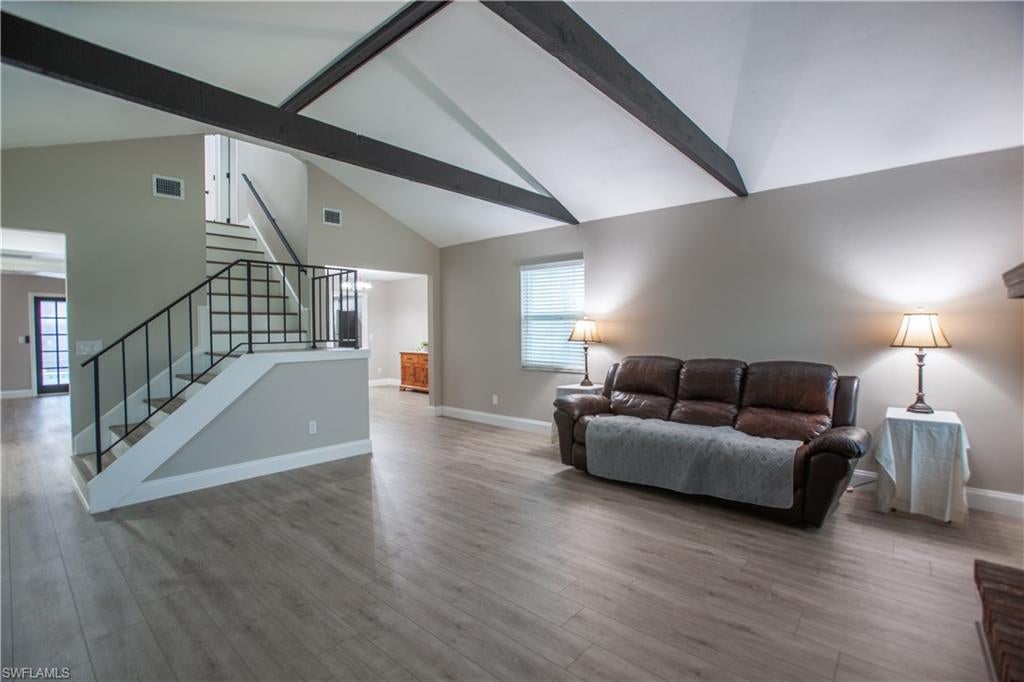 PRICED TO SELL! THIS HOME IS PERFECT FOR ALL YOUR TOYS! This beautifully maintained home offers 1,900 sqft of living space on a generous 0.36-acre corner lot. Not only do they have an oversize driveway, there is a extra driveway behind the house which is 13x70. This home offer a spacious Layout: 3 bedrooms and 2 full bathrooms ideal for family living or hosting guests. A convenient half-bath downstairs adds to the home's functionality. The main level boasts a cozy living room anchored by a wood-burning fireplace, a formal dining area, and a family room. Agua Guard water proof wood-based laminate flooring flows throughout the whole home. The kitchen features 2-yr old stainless-steel appliances, a breakfast bar, and formal dining room which are perfect for casual meals and entertaining. Upstairs, the master bedroom features sliding glass doors that open to a private, two-story balcony—your serene vantage point for morning coffee or evening relaxation. Enjoy Florida living in the spacious lanai surrounding a sparkling in-ground pool and accented with a decorative pool deck. The lush .36-acre lot includes a 12×20 shed with a loft, insulated, and equipped with electricity and mini-AC—an ideal spot for a workshop or hobby space. Attached two-car garage plus a single-car carport. The first-floor was updated with a new air conditioning system and the home is built on a durable slab foundation with a metal roof .