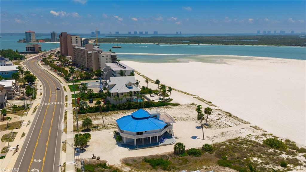 One or more photo(s) has been virtually staged, AI generated or rendered.  One or more photo(s) has been virtually staged, AI generated or rendered.

BUY THE BEACH NOW. ENJOY IT TODAY. DREAM BIG FOR TOMORROW. Set directly on the sugar-white sands of Fort Myers Beach, this distinctive south-end Gulf-front property presents an exciting opportunity for beach lovers, investors, and buyers who understand the long-term value of owning irreplaceable beachfront land.

Situated on an impressive 80-foot-wide beachfront lot, the property combines immediate enjoyment and income potential with an extraordinary canvas for the future. Keep the existing elevated residence and enjoy an effortless beach retreat from day one, continue operating it as an income-producing vacation property, explore opportunities to expand the outdoor living experience with a pool, or begin imagining a future custom Gulf-front estate tailored entirely to your vision. Any future improvements, expansion, pool installation, or redevelopment are subject to applicable zoning, setbacks, permitting, and governmental approvals.

The existing home is anything but ordinary. Its distinctive octagonal architectural design creates character throughout while capturing Gulf views, natural light, coastal breezes, and spectacular sunsets from multiple vantage points. Elevated construction adds another layer of appeal for coastal ownership.

Inside, the home offers 3 bedrooms, 2.5 bathrooms, plus a generous loft with additional sleeping accommodations, providing flexibility for family, friends, and vacation guests. The layout feels relaxed and unmistakably beach-oriented—the kind of property where shoes come off, doors open, and the Gulf becomes part of everyday life.

For investors, the opportunity is equally compelling. The home is currently operating as an income-generating property, allowing a new owner to step into an established beachfront asset while considering longer-term plans for the site. Rather than purchasing vacant beachfront land and waiting to create value, this property offers the ability to own, enjoy, and potentially generate income now while planning for what comes next.

And then there is the location. Positioned on the coveted south end of Fort Myers Beach, you’ll enjoy a quieter, more residential atmosphere while remaining convenient to island dining and shopping, Bonita Springs, Naples, and Southwest Florida International Airport.

Whether your vision is a turnkey beach escape, vacation-rental investment, enhanced coastal retreat with a pool, or the future site of your dream beachfront residence, this is the kind of opportunity that is increasingly difficult to replicate.

85 feet of Gulf frontage. An existing income-producing home. Direct access to the sand. And a future limited only by your imagination.